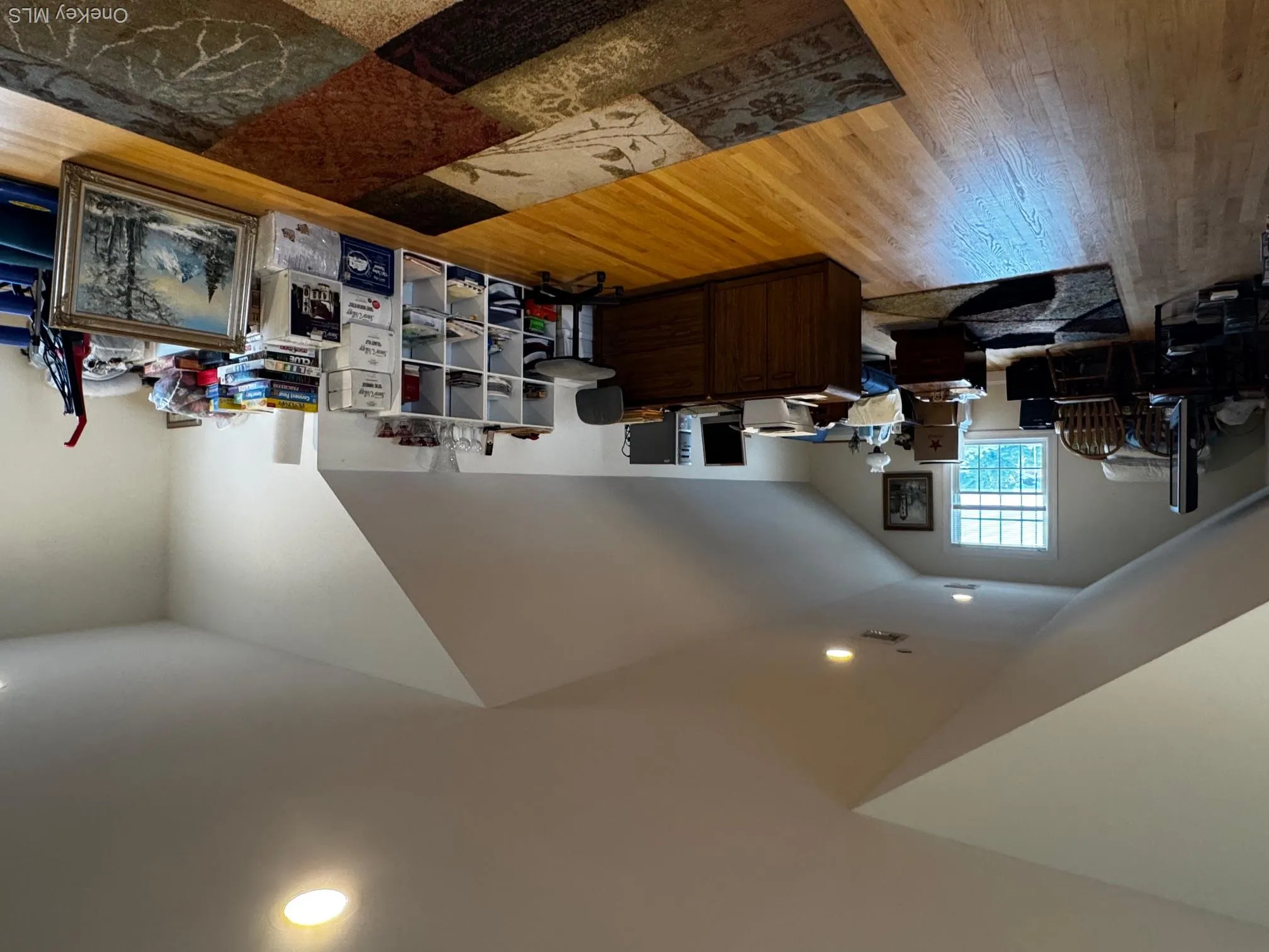 Home office featuring wood finished floors, vaulted ceiling, and recessed lighting Home office featuring wood finished floors, vaulted ceiling, and recessed lighting