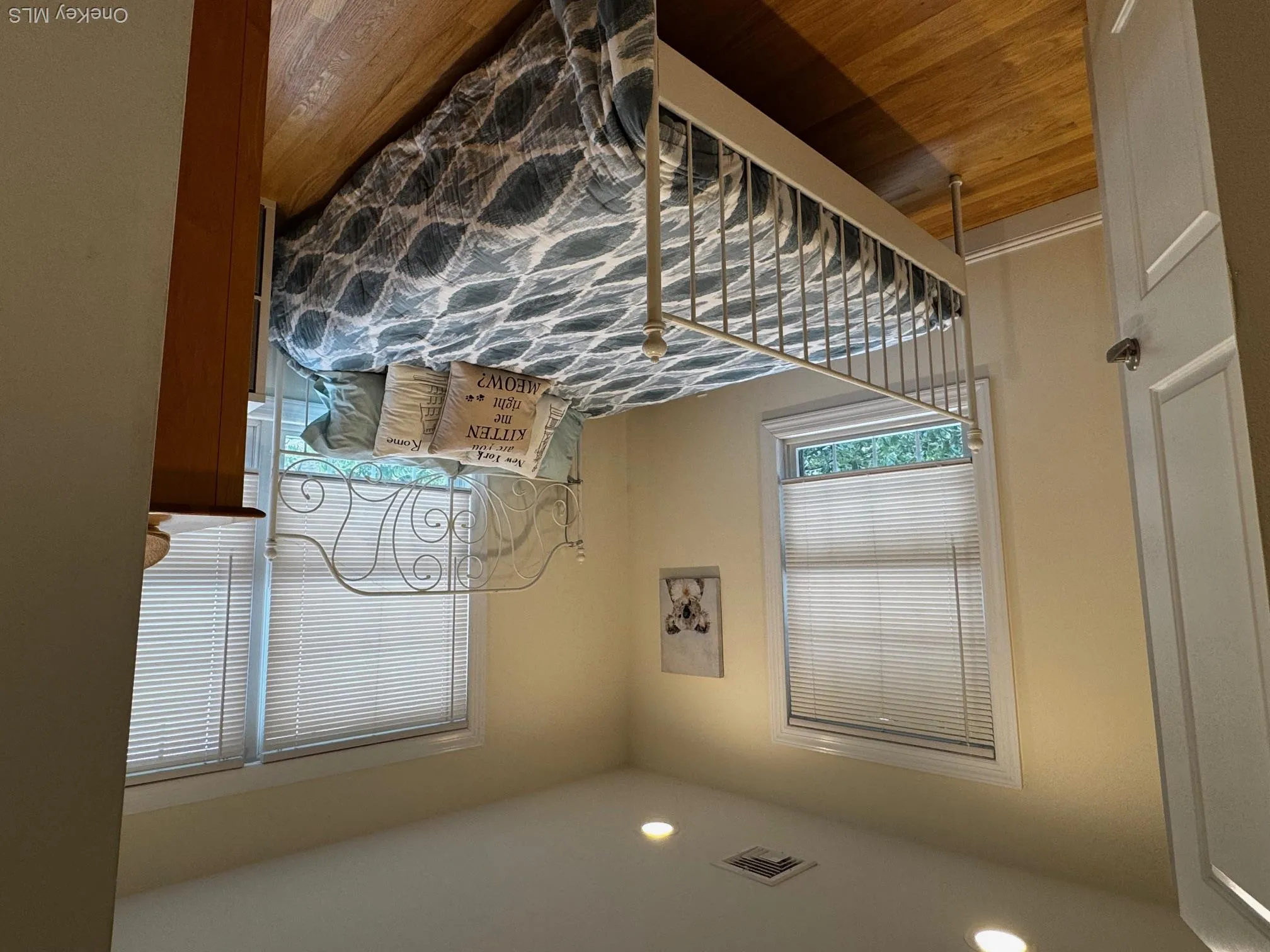 Bedroom with wood finished floors and recessed lighting Bedroom with wood finished floors and recessed lighting