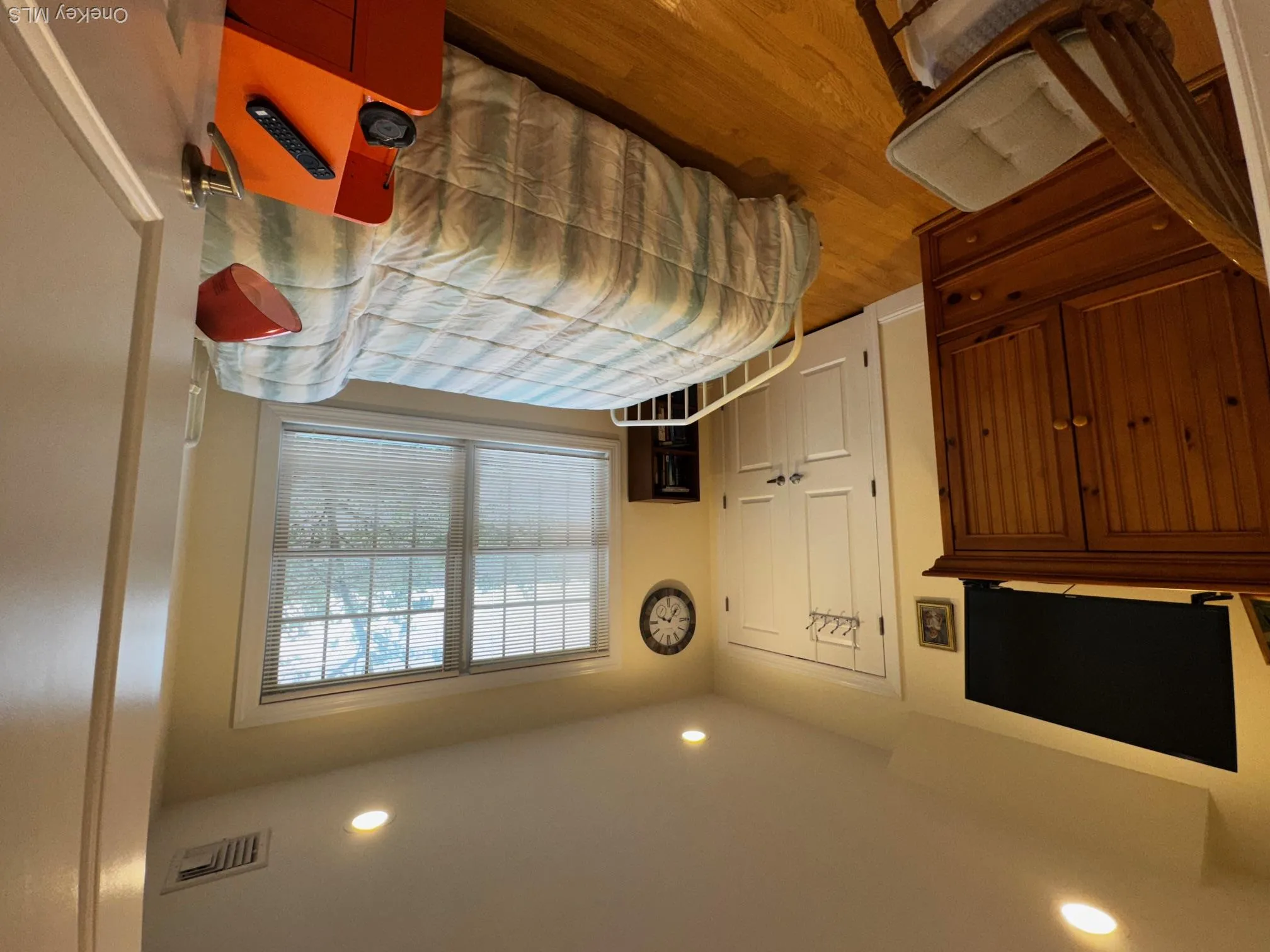 Bedroom featuring light wood-style flooring and recessed lighting Bedroom featuring light wood-style flooring and recessed lighting