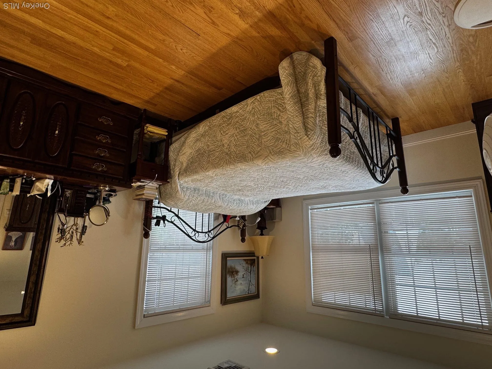 Bedroom featuring wood finished floors, multiple windows, and recessed lighting Bedroom featuring wood finished floors, multiple windows, and recessed lighting