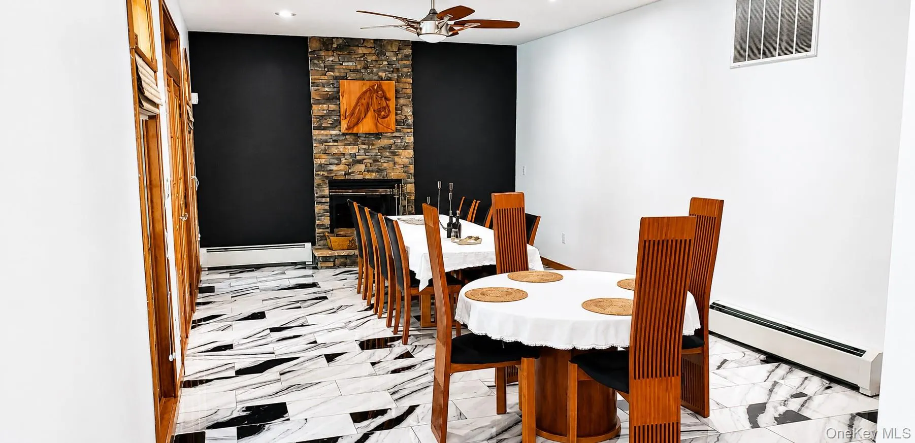 Spacious room featuring striking black and white patterned tile flooring Spacious room featuring striking black and white patterned tile flooring
