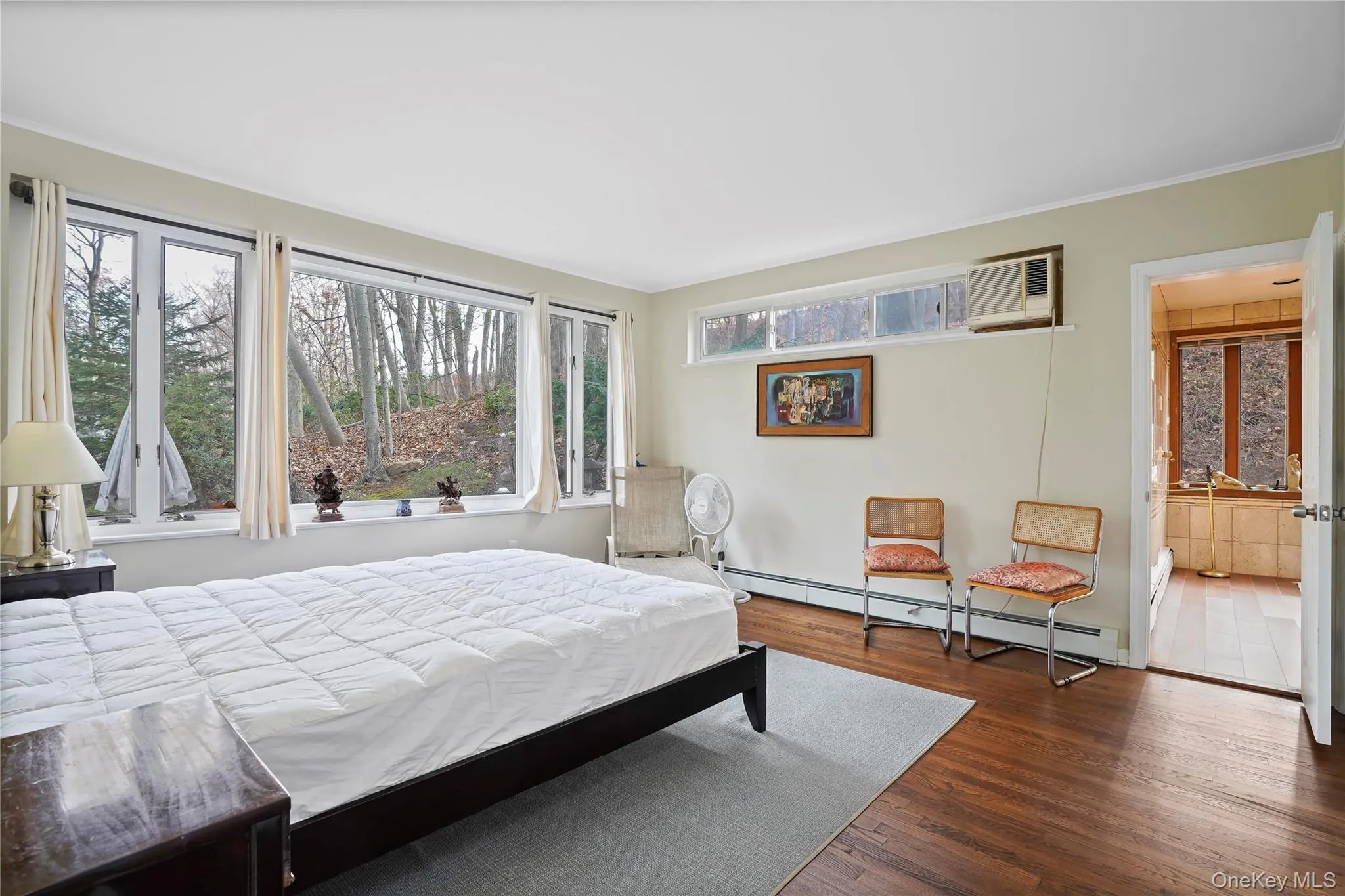 Primary Bedroom With Large Windows, Good Closet Space & A Large En Suite Bathroom Primary Bedroom With Large Windows, Good Closet Space & A Large En Suite Bathroom