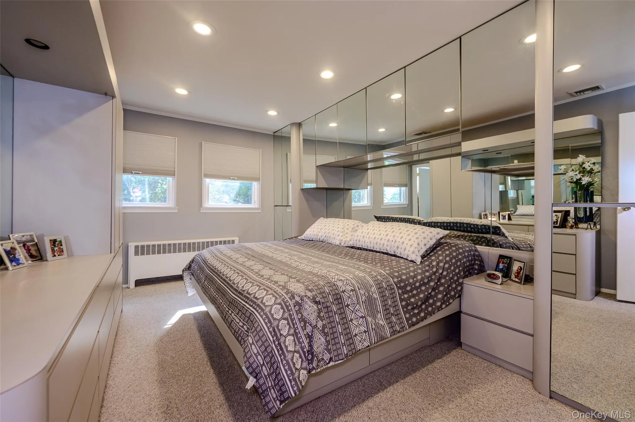Primary bedroom with recessed lighting Primary bedroom with recessed lighting