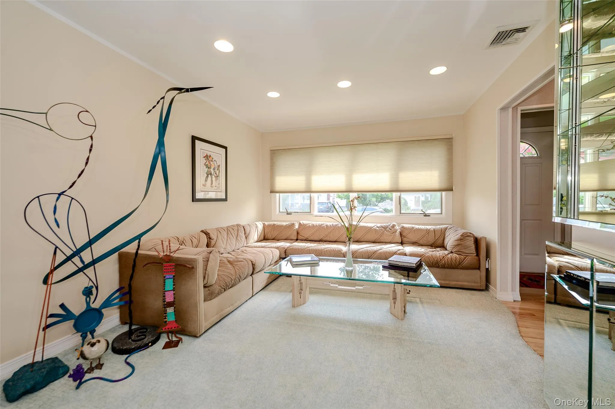 Living room with recessed lighting and picture window Living room with recessed lighting and picture window