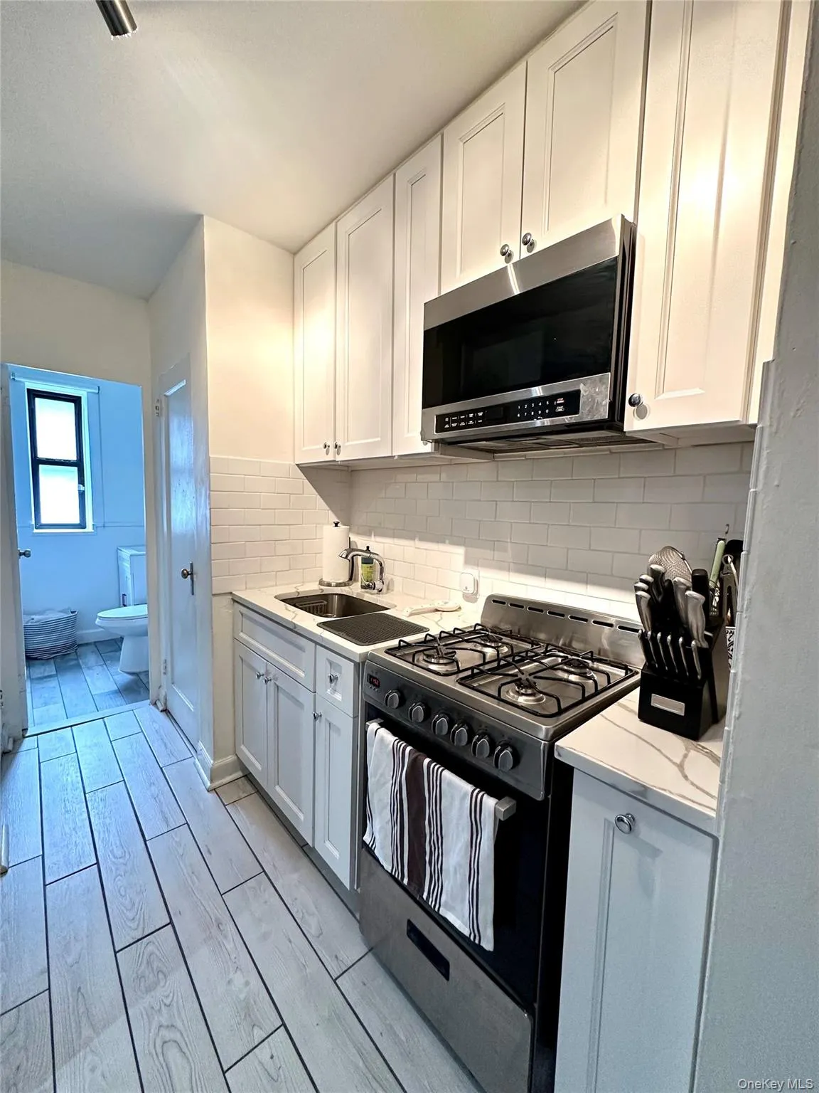 Renovated kitchen with subway tile and granite counter top - soft close cabinets Renovated kitchen with subway tile and granite counter top - soft close cabinets