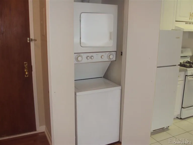 Stackable Washer/Dryer conveniently in unit Stackable Washer/Dryer conveniently in unit