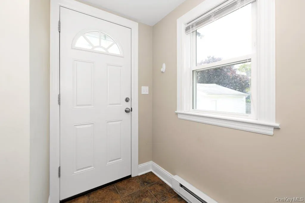 Door to driveway and backyard Door to driveway and backyard