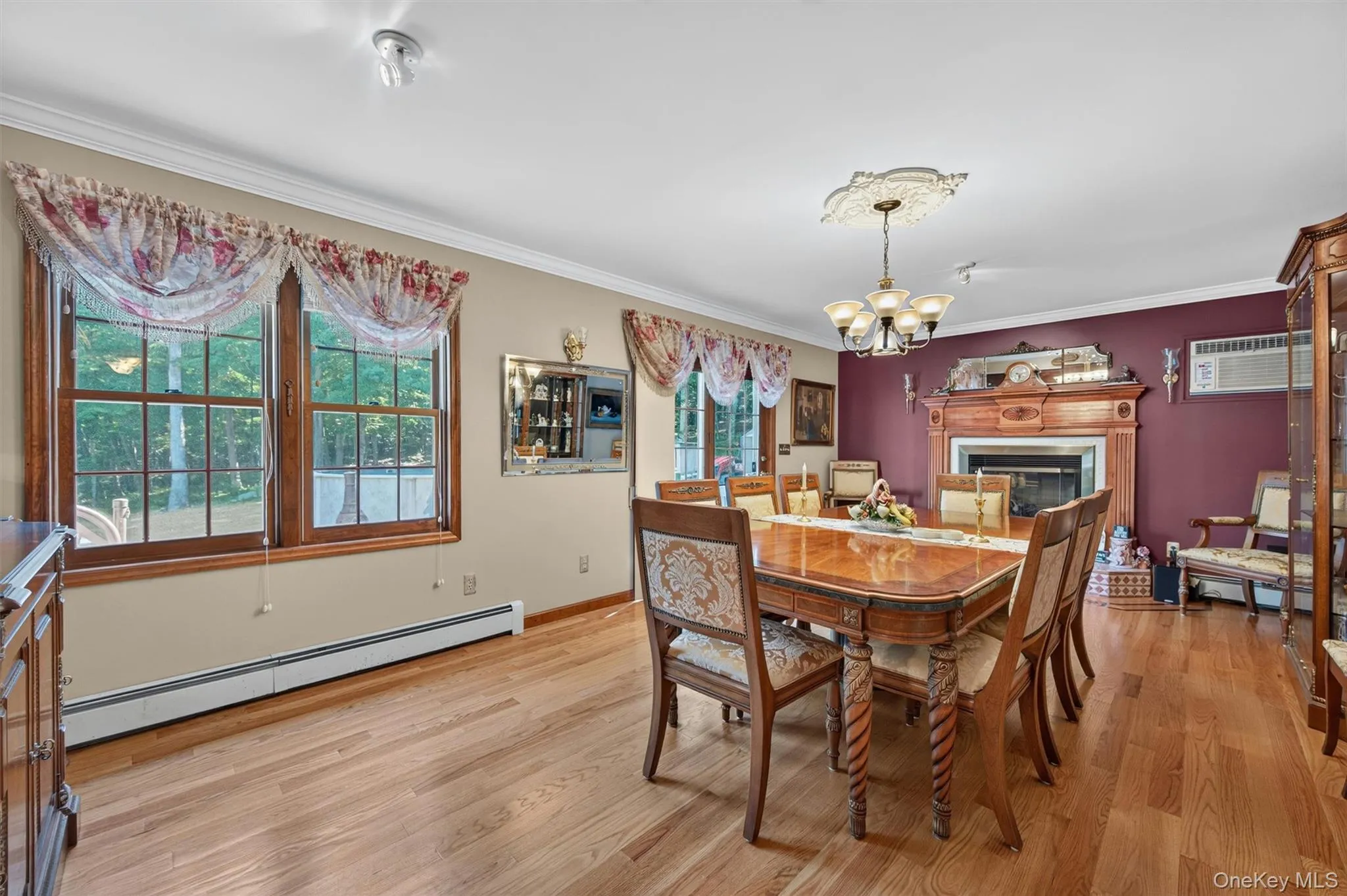 Formal dining room with large windows to backyard view. Formal dining room with large windows to backyard view.