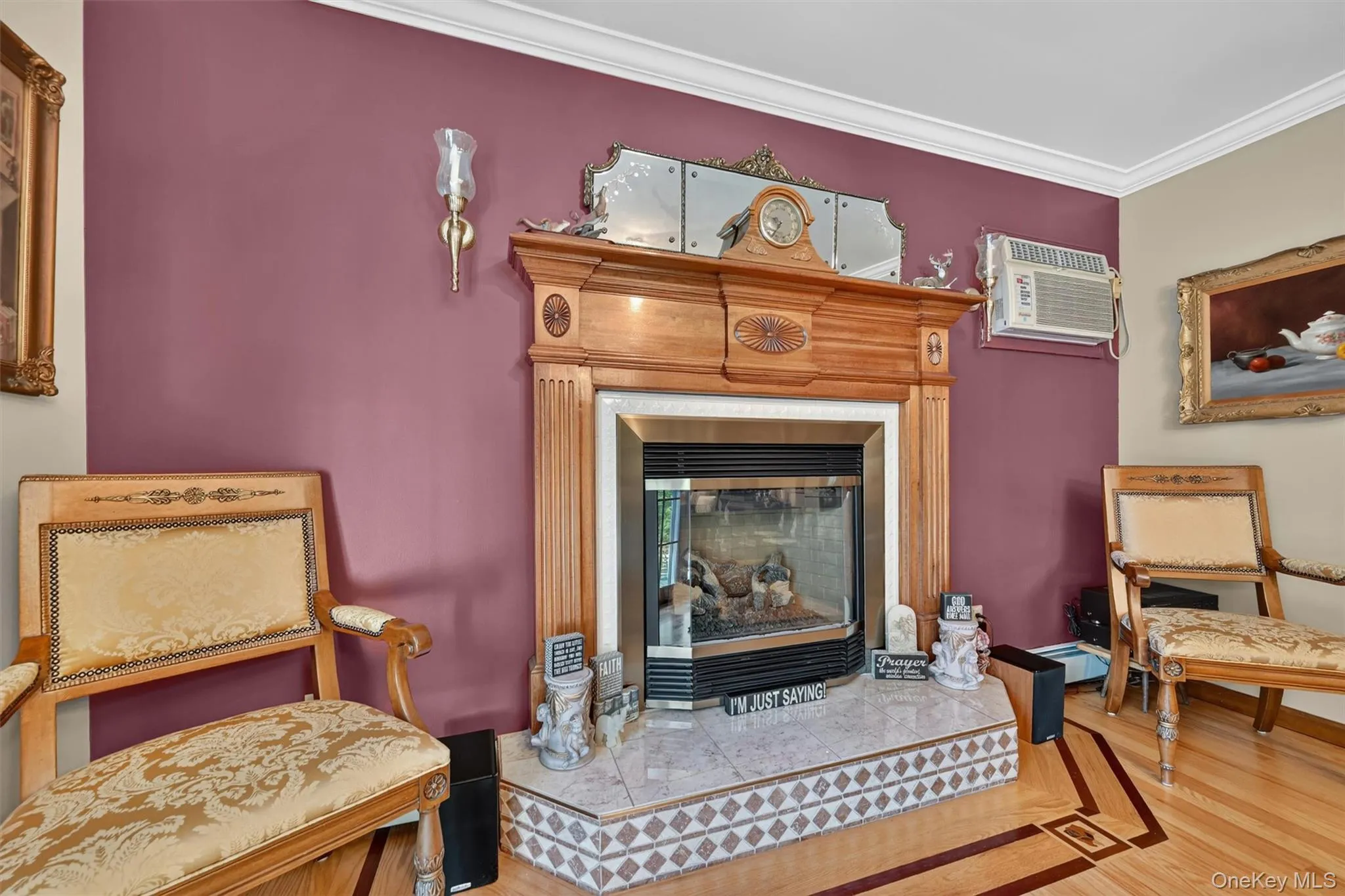 Closeup of fireplace in formal dining room with beautiful inlaid floor design. Closeup of fireplace in formal dining room with beautiful inlaid floor design.