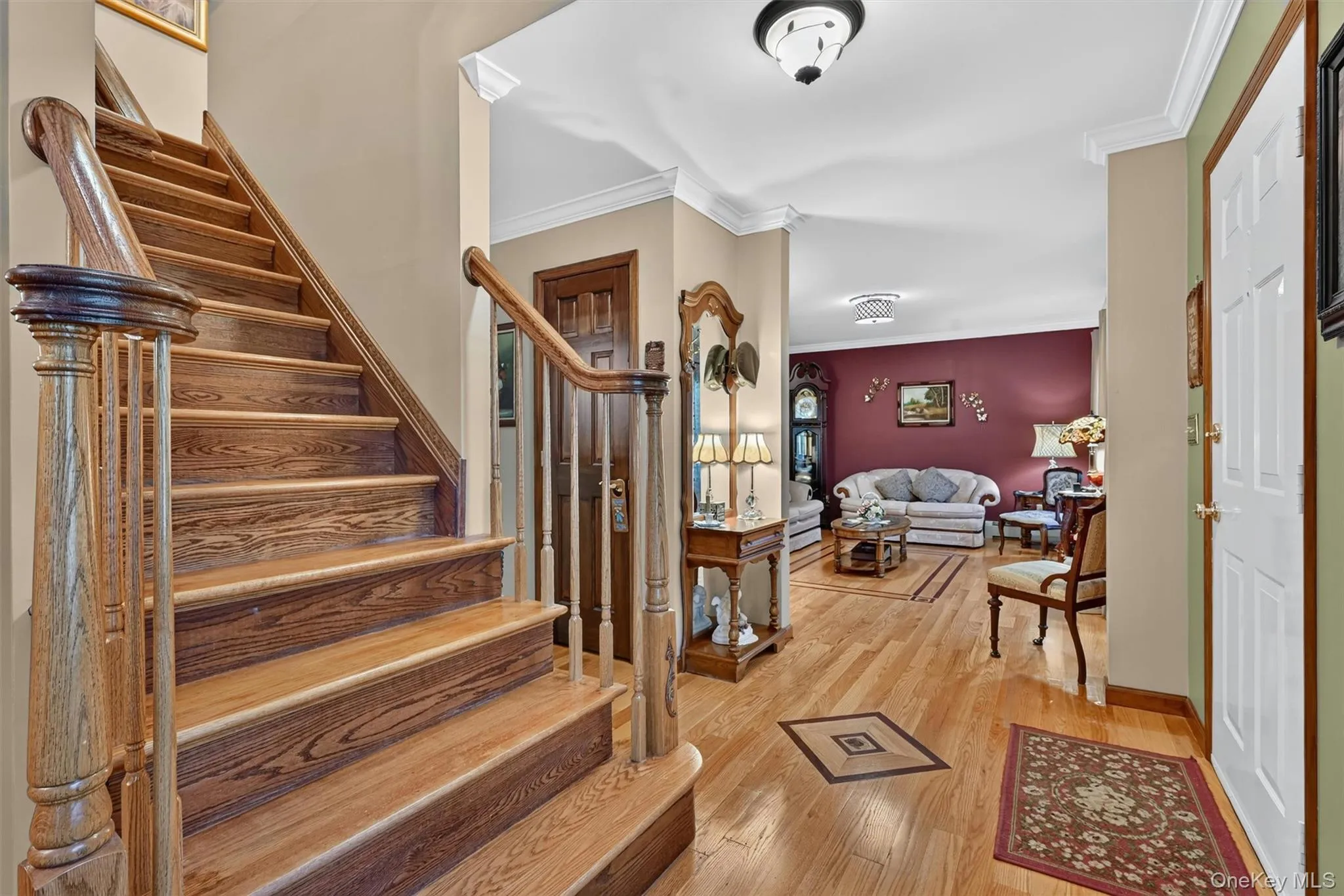 Stairs going up with view of living room. Stairs going up with view of living room.