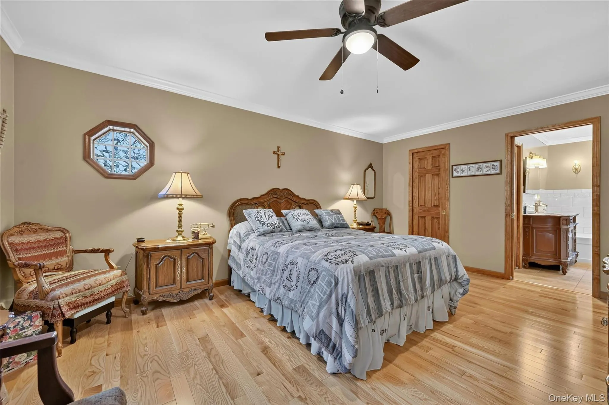 Primary bedroom showing doorways to walk in closet and full bath. Primary bedroom showing doorways to walk in closet and full bath.