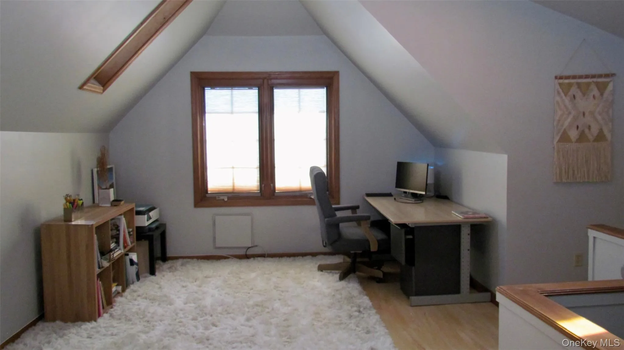 Third floor, room with sloped ceilings and light wood-finish flooring Third floor, room with sloped ceilings and light wood-finish flooring