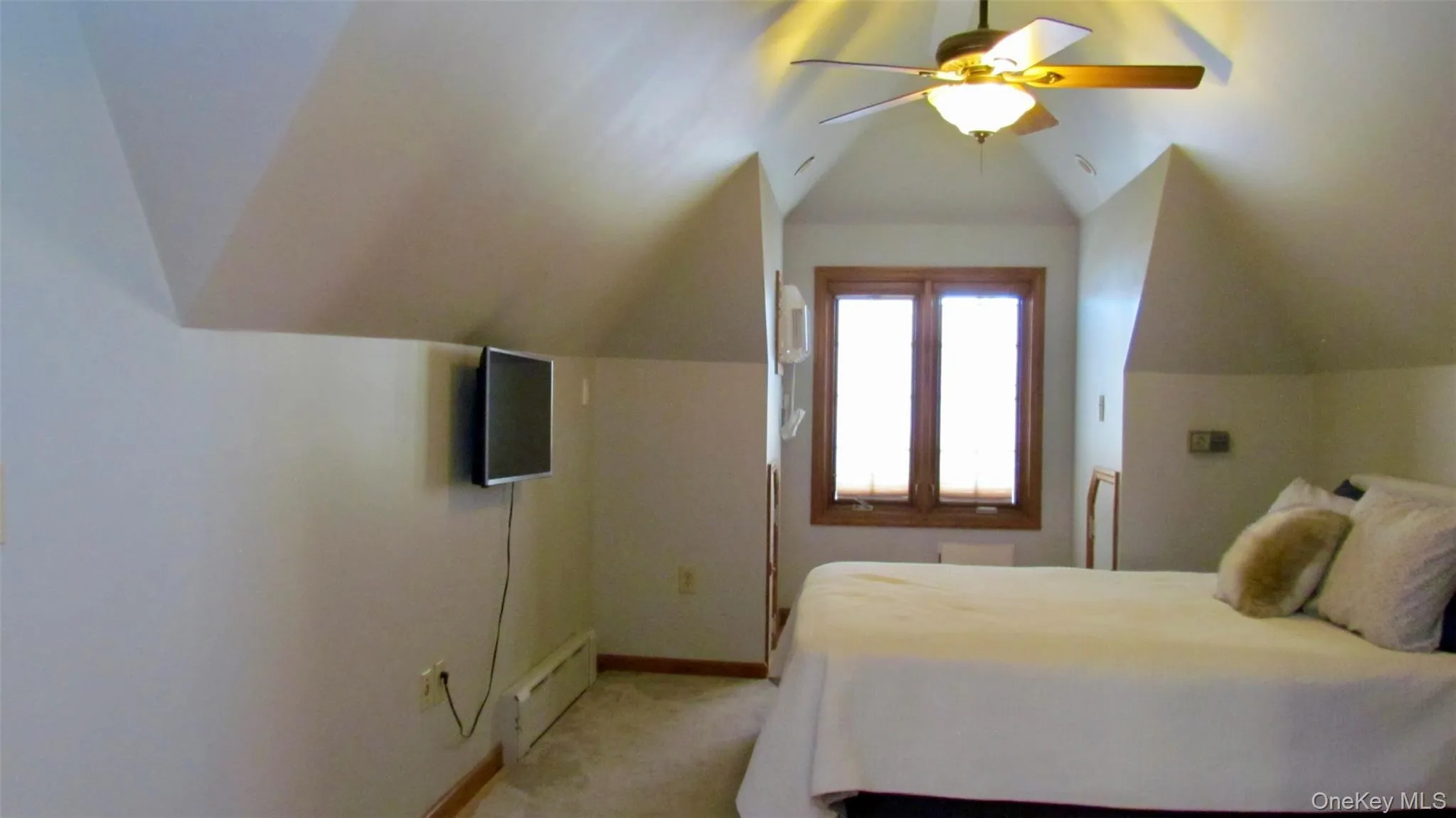Third floor, room featuring sloped ceilings, a wood-framed window with blinds, and a ceiling fan with integrated lighting Third floor, room featuring sloped ceilings, a wood-framed window with blinds, and a ceiling fan with integrated lighting
