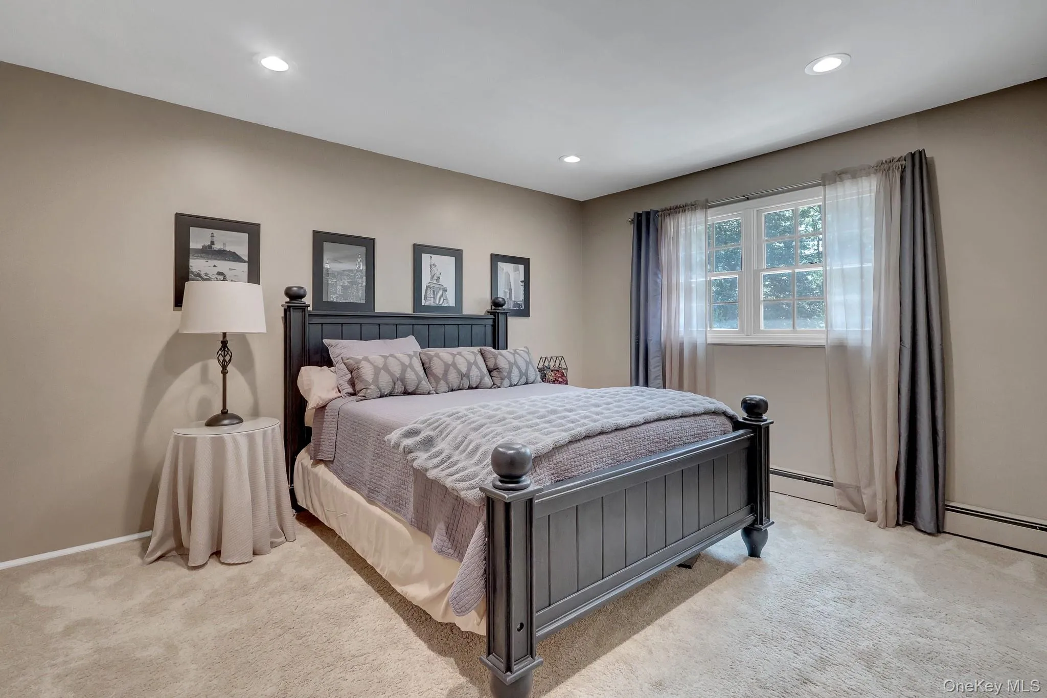 Carpeted room featuring a double-paned window, recessed lighting, and neutral wall paint Carpeted room featuring a double-paned window, recessed lighting, and neutral wall paint