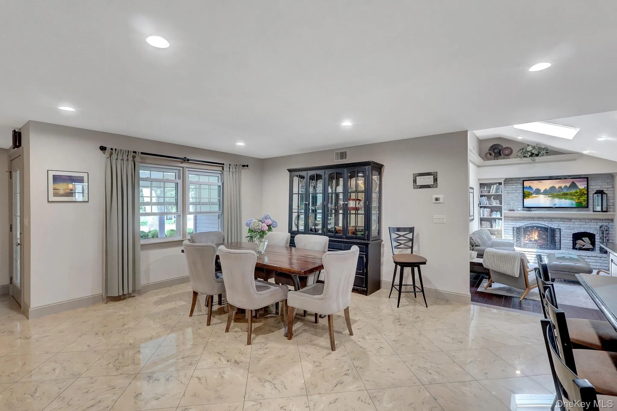 Open-concept dining area featuring ceramic square tile flooring (radiant heat) and recessed lighting Open-concept dining area featuring ceramic square tile flooring (radiant heat) and recessed lighting