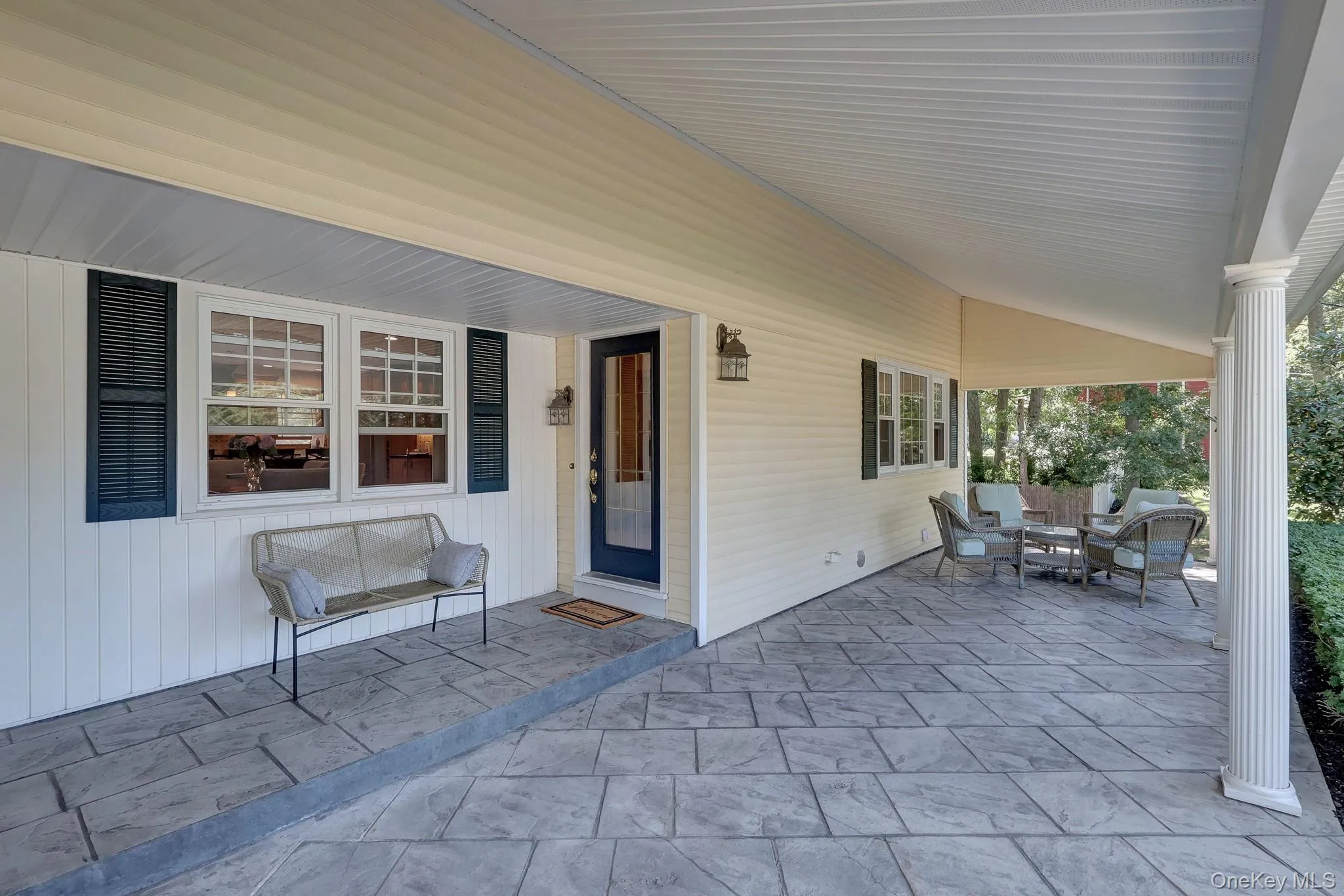Extended Covered patio featuring stamped concrete flooring Extended Covered patio featuring stamped concrete flooring