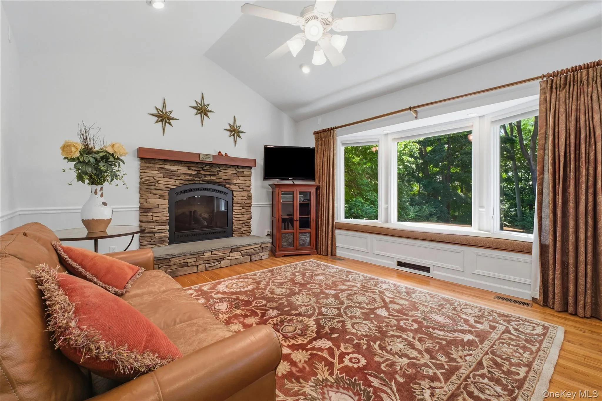 Den/Family room w/gas fireplace featuring slate hearth and wood beam mantle Den/Family room w/gas fireplace featuring slate hearth and wood beam mantle