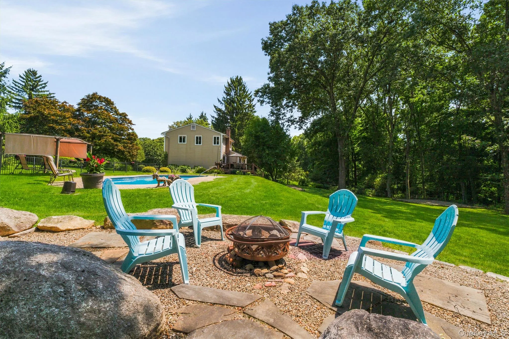 Enjoy evenings by the fire pit in your backyard oasis with family & friends Enjoy evenings by the fire pit in your backyard oasis with family & friends
