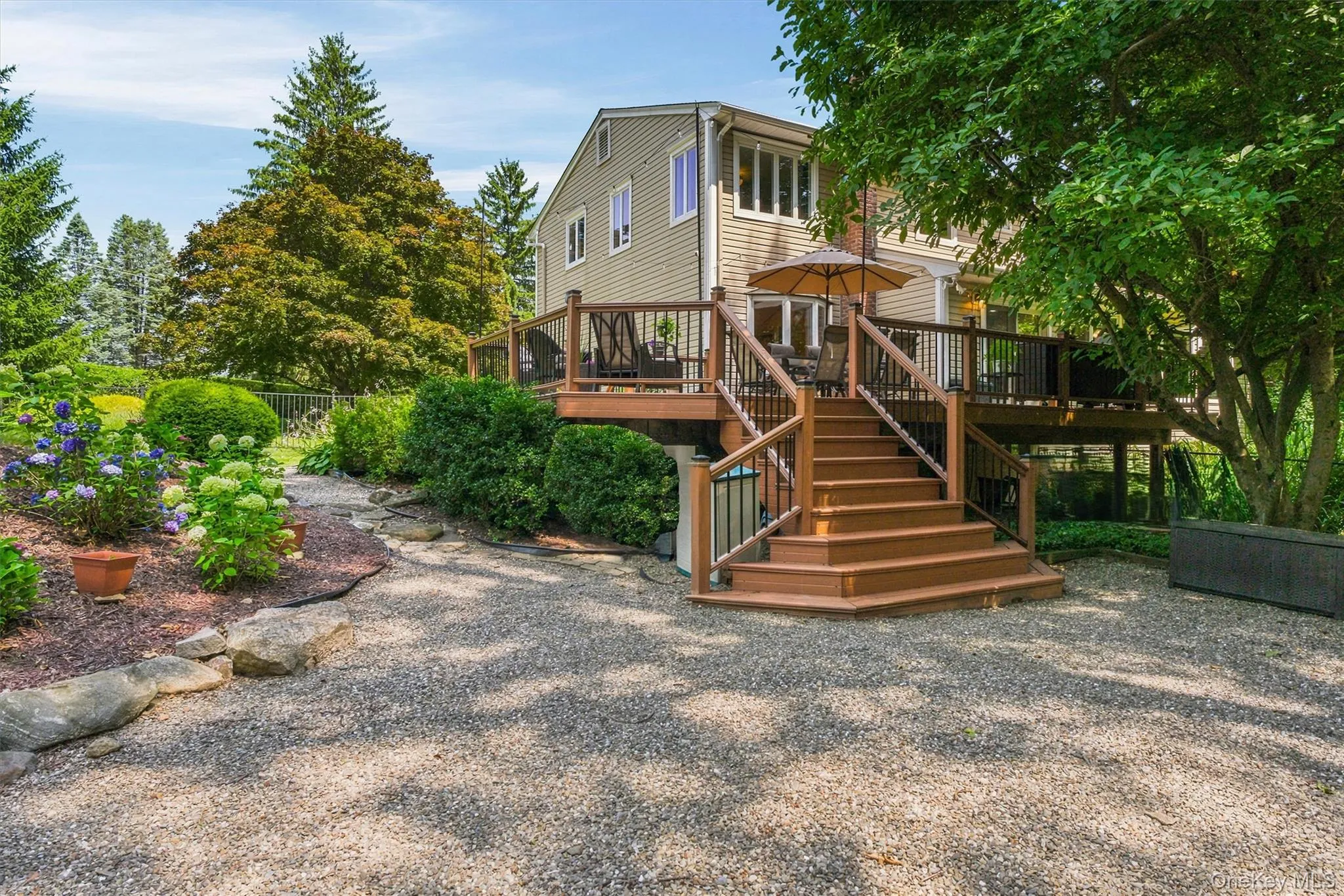 View of back of deck leading to spacious 1.4 acre property View of back of deck leading to spacious 1.4 acre property