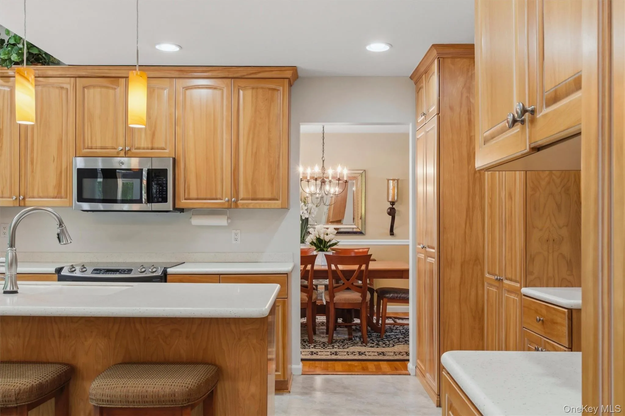 Cabinetry extends to ceiling offering fantastic storage Cabinetry extends to ceiling offering fantastic storage