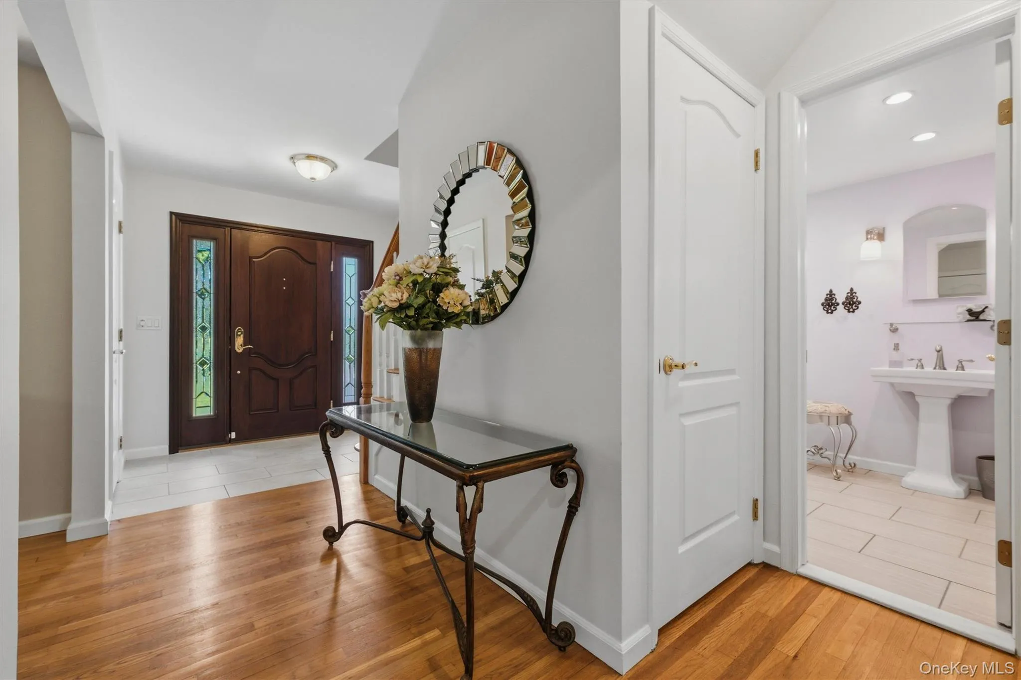 Open tiled entryway w/ 2 large closets, newly refinished Therma Tru front door Open tiled entryway w/ 2 large closets, newly refinished Therma Tru front door