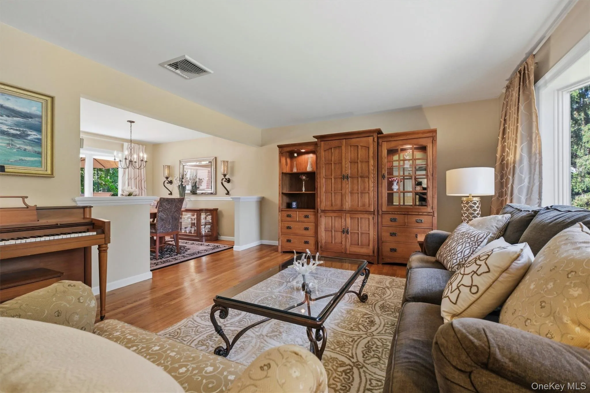 Living room w/hardwood floors, and front facing Andersen Bay window Living room w/hardwood floors, and front facing Andersen Bay window