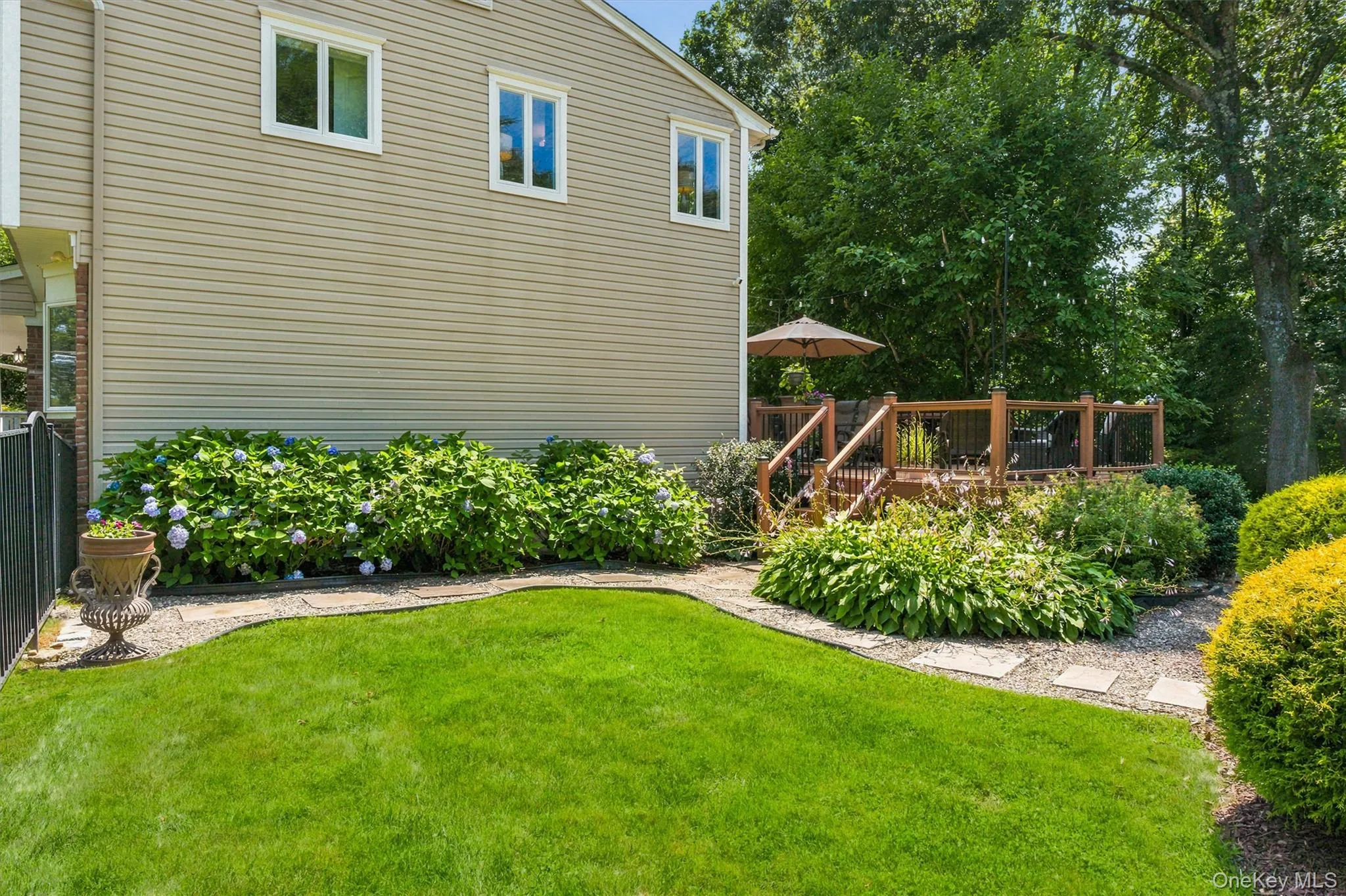 Such a pretty setting, the yard is peaceful, well-manicured & lovingly cared for. Such a pretty setting, the yard is peaceful, well-manicured & lovingly cared for.