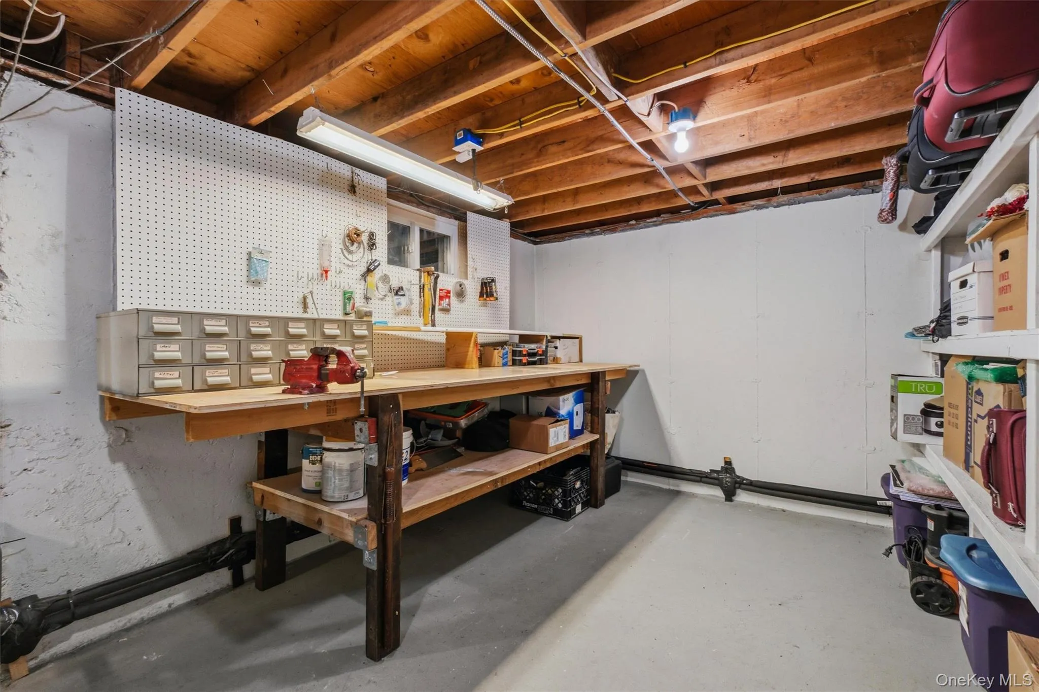 Workshop area w/built-in storage, and also houses the very well-maintained mechanicals Workshop area w/built-in storage, and also houses the very well-maintained mechanicals
