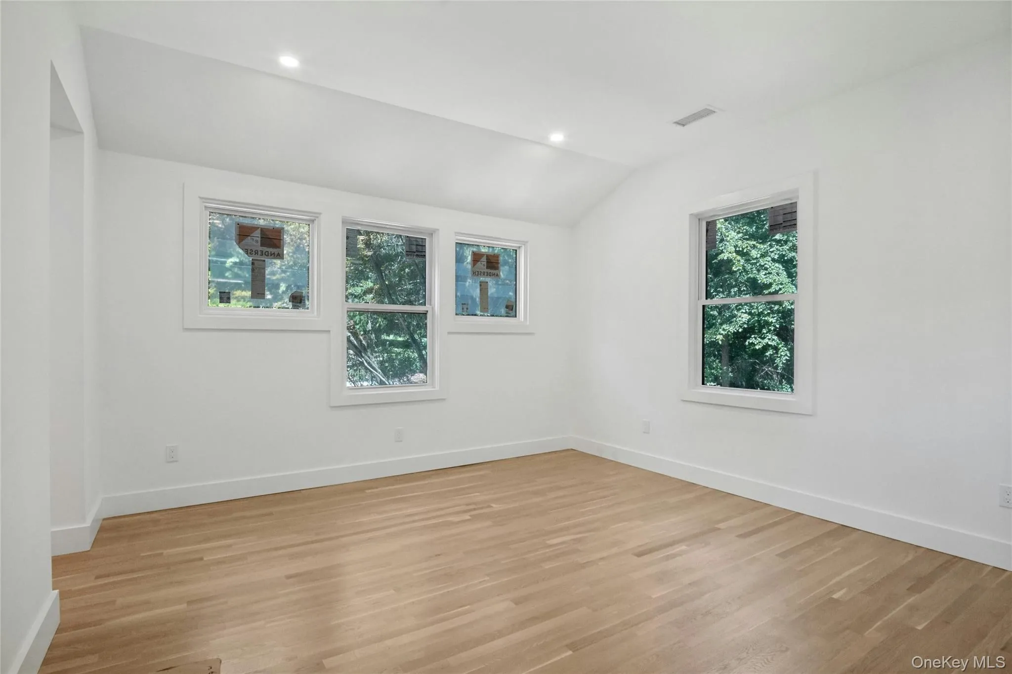 Primary Bedroom with high ceilings, recessed lighting and Anderson windows Primary Bedroom with high ceilings, recessed lighting and Anderson windows