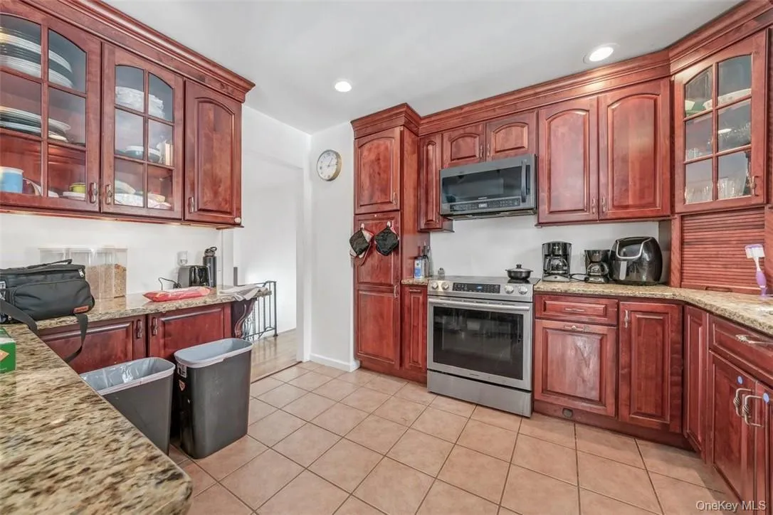 Kitchen with cherry wood cabinetry Kitchen with cherry wood cabinetry
