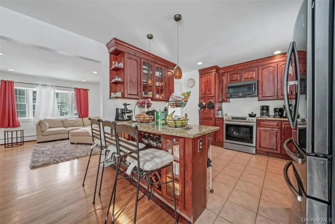 Cherry wood kitchen cabinetry with wine/beverage cooler Cherry wood kitchen cabinetry with wine/beverage cooler