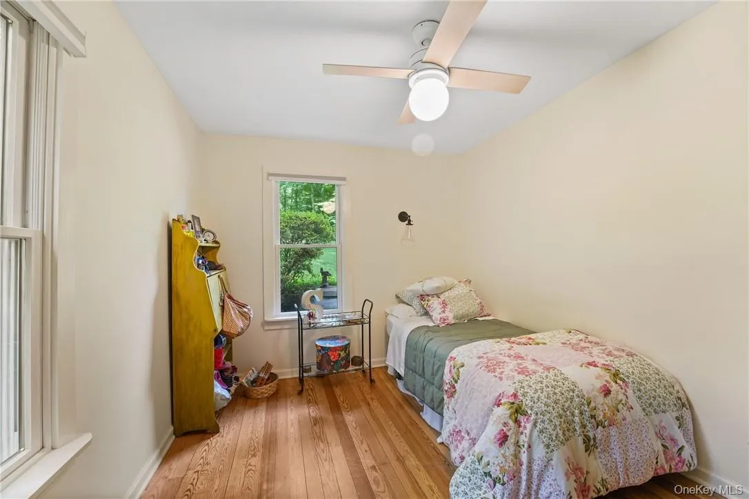 Den on 1st floor with ceiling fan and hardwood floors Den on 1st floor with ceiling fan and hardwood floors