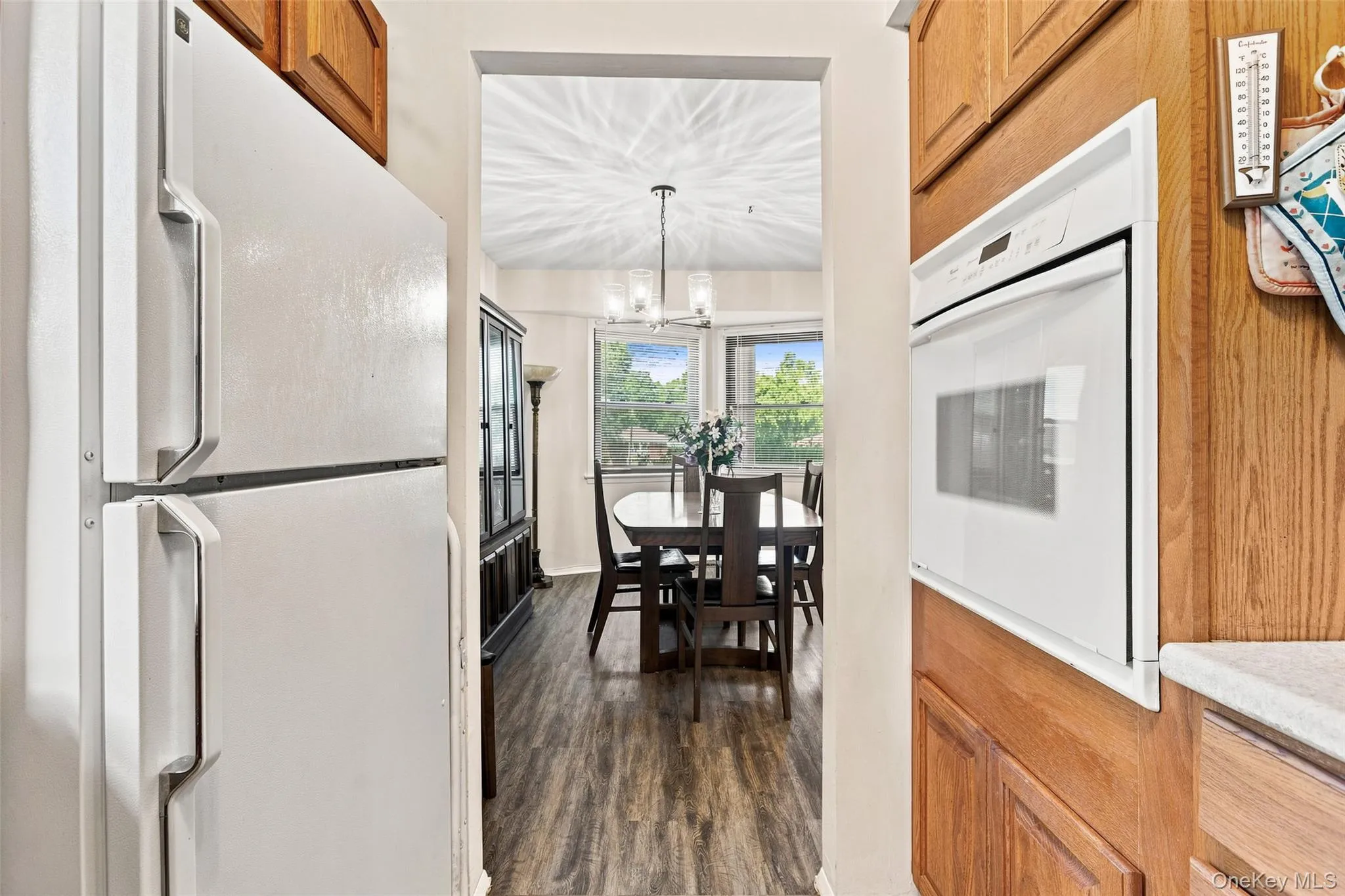 Looking into dining area and out front windows Looking into dining area and out front windows