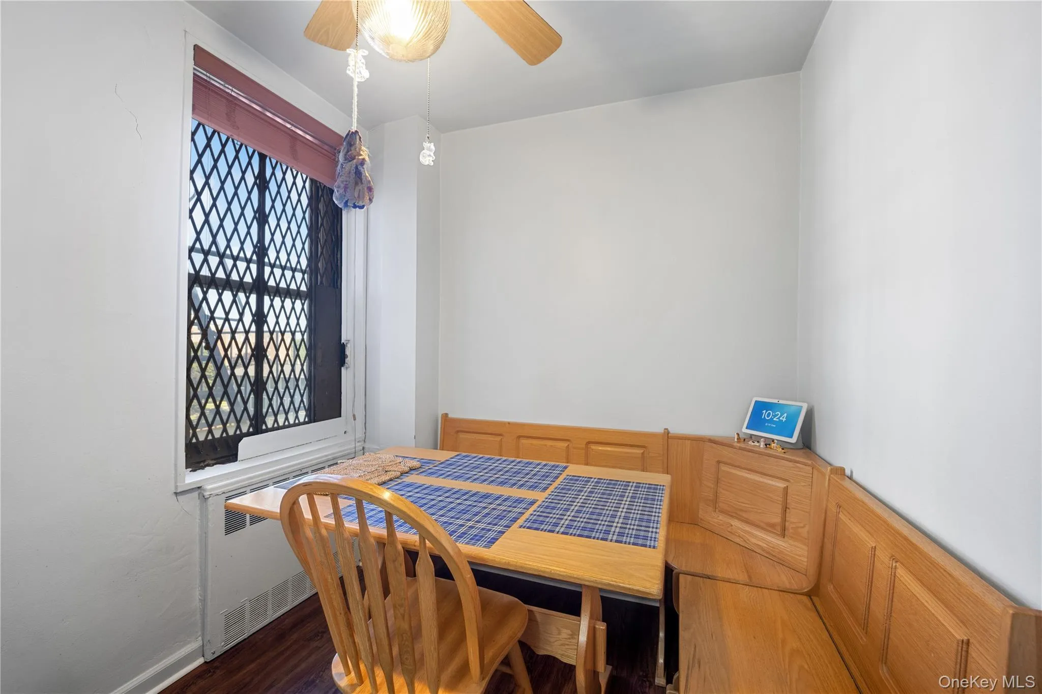 Built-in wood-finish banquette seating with a coordinating wood-finish dining table Built-in wood-finish banquette seating with a coordinating wood-finish dining table