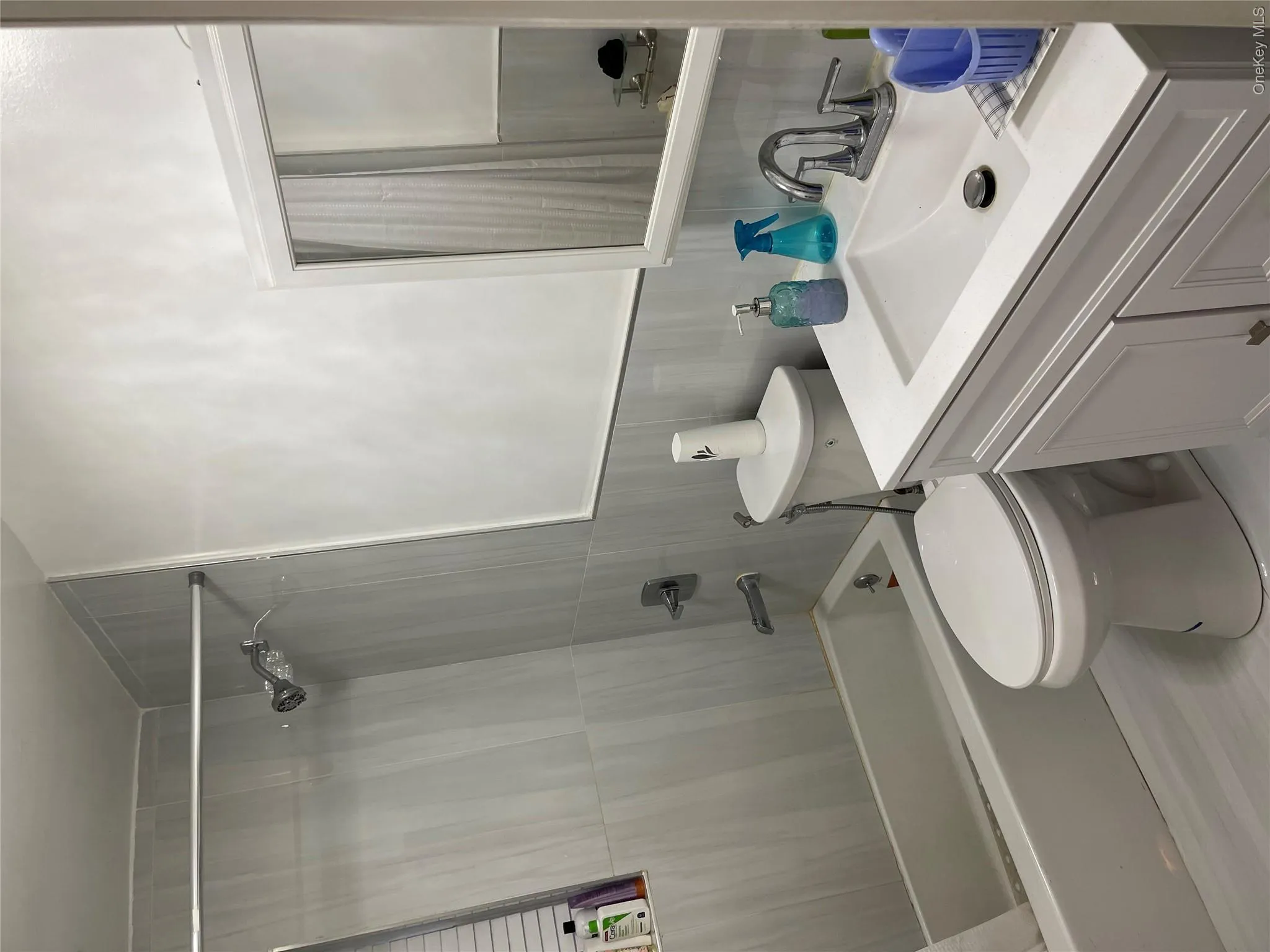 Full bathroom featuring shower combination and vanity Full bathroom featuring shower combination and vanity
