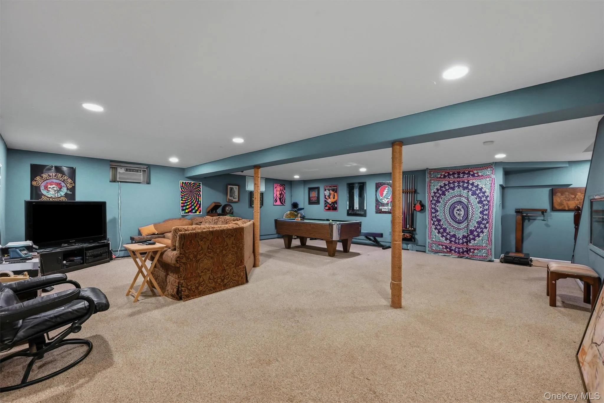 Spacious finished basement featuring flexible living and recreation space for a variety of uses. Spacious finished basement featuring flexible living and recreation space for a variety of uses.