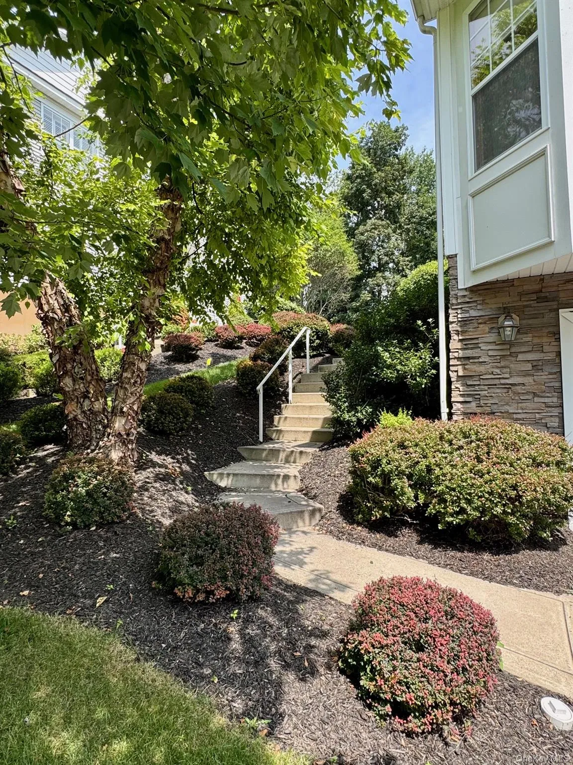 View of yard featuring stairway View of yard featuring stairway