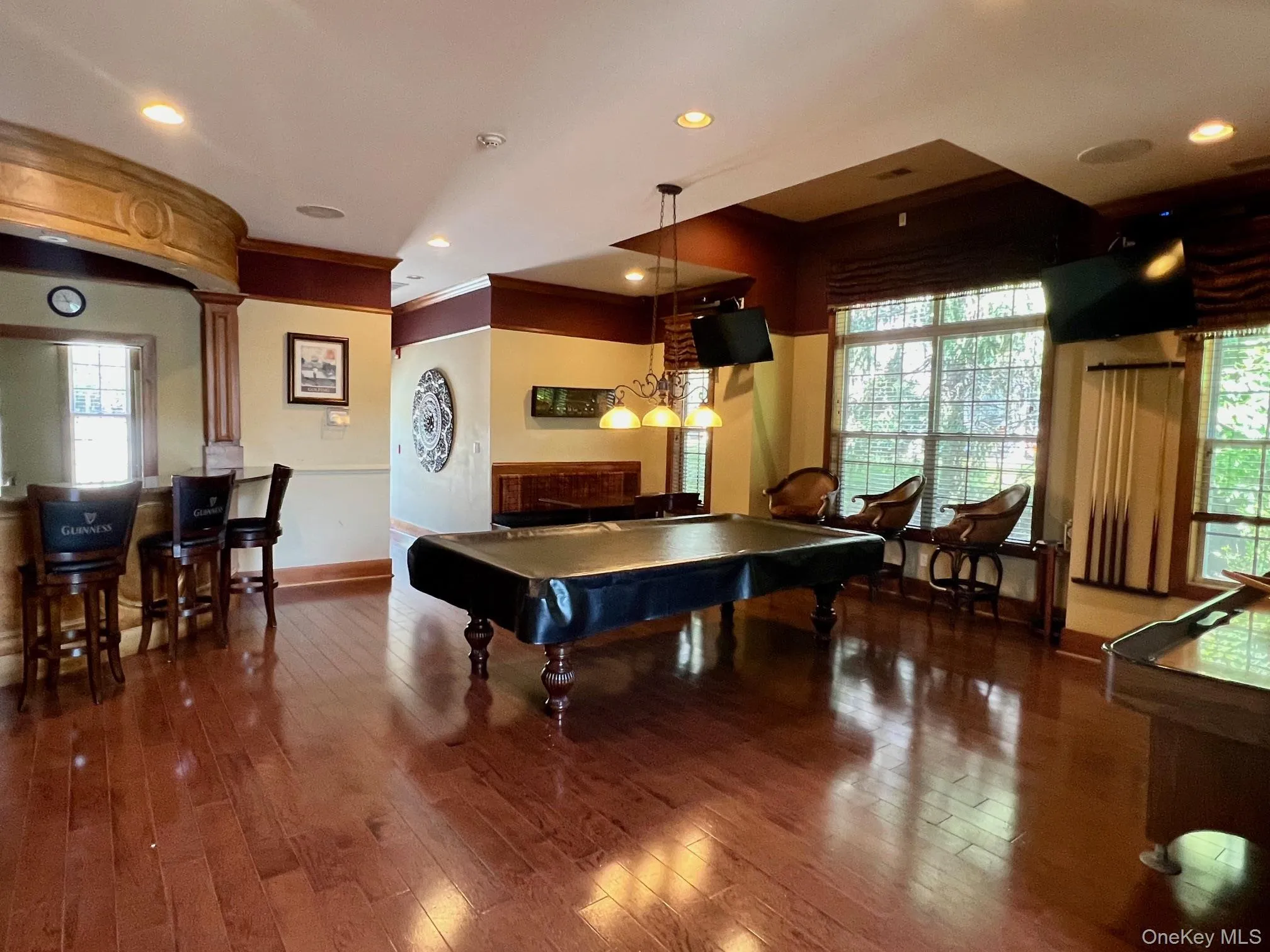 Recreation room featuring pool table, hardwood / wood-style floors, healthy amount of natural light, and recessed lighting Recreation room featuring pool table, hardwood / wood-style floors, healthy amount of natural light, and recessed lighting