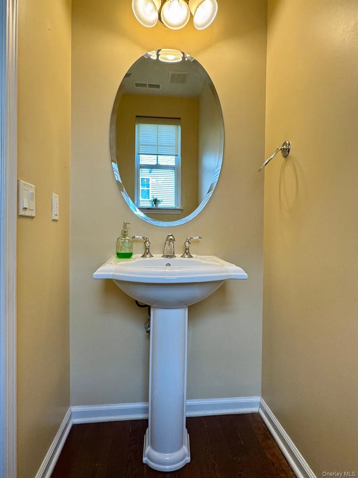 Bathroom featuring wood finished floors Bathroom featuring wood finished floors