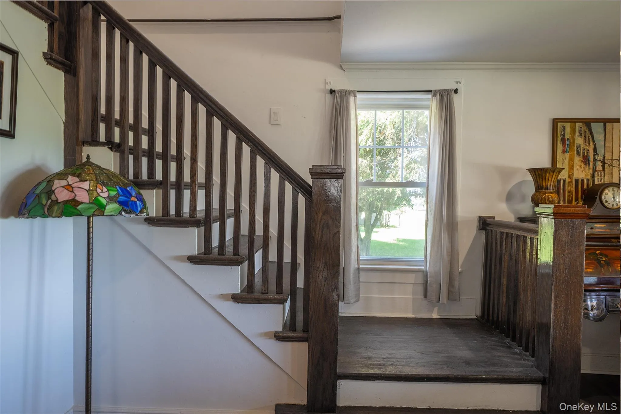 Beautiful front and rear staircases brings the charm and character of this historic Craftsman home together. The back stairs come from the bedrooms to the country kitchen. Beautiful front and rear staircases brings the charm and character of this historic Craftsman home together. The back stairs come from the bedrooms to the country kitchen.