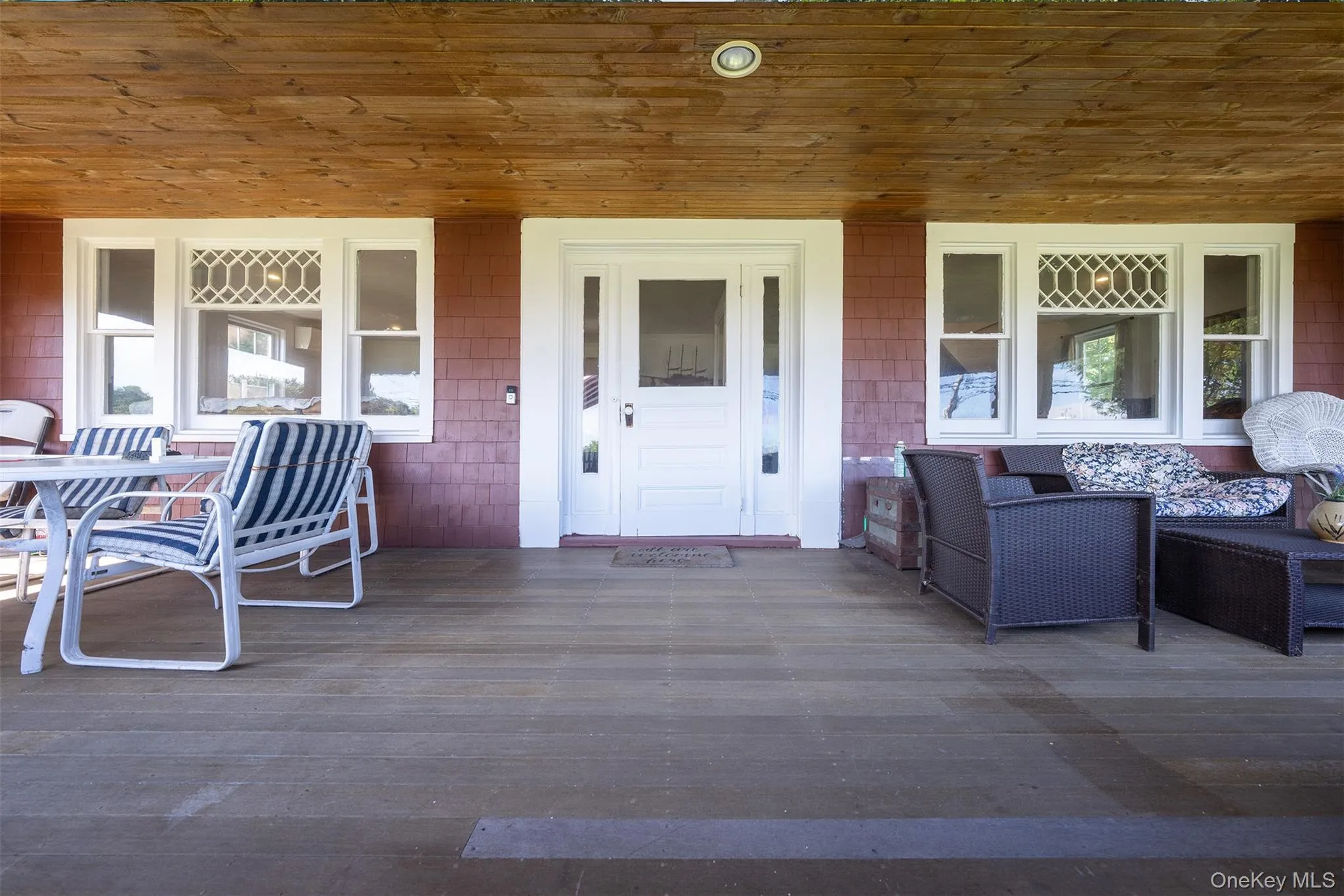 Super wide front porch was added in the 1920's by the King family and you can see why. Cool breeze and wide spaces to hang out and take in Orient Point living. Super wide front porch was added in the 1920's by the King family and you can see why. Cool breeze and wide spaces to hang out and take in Orient Point living.