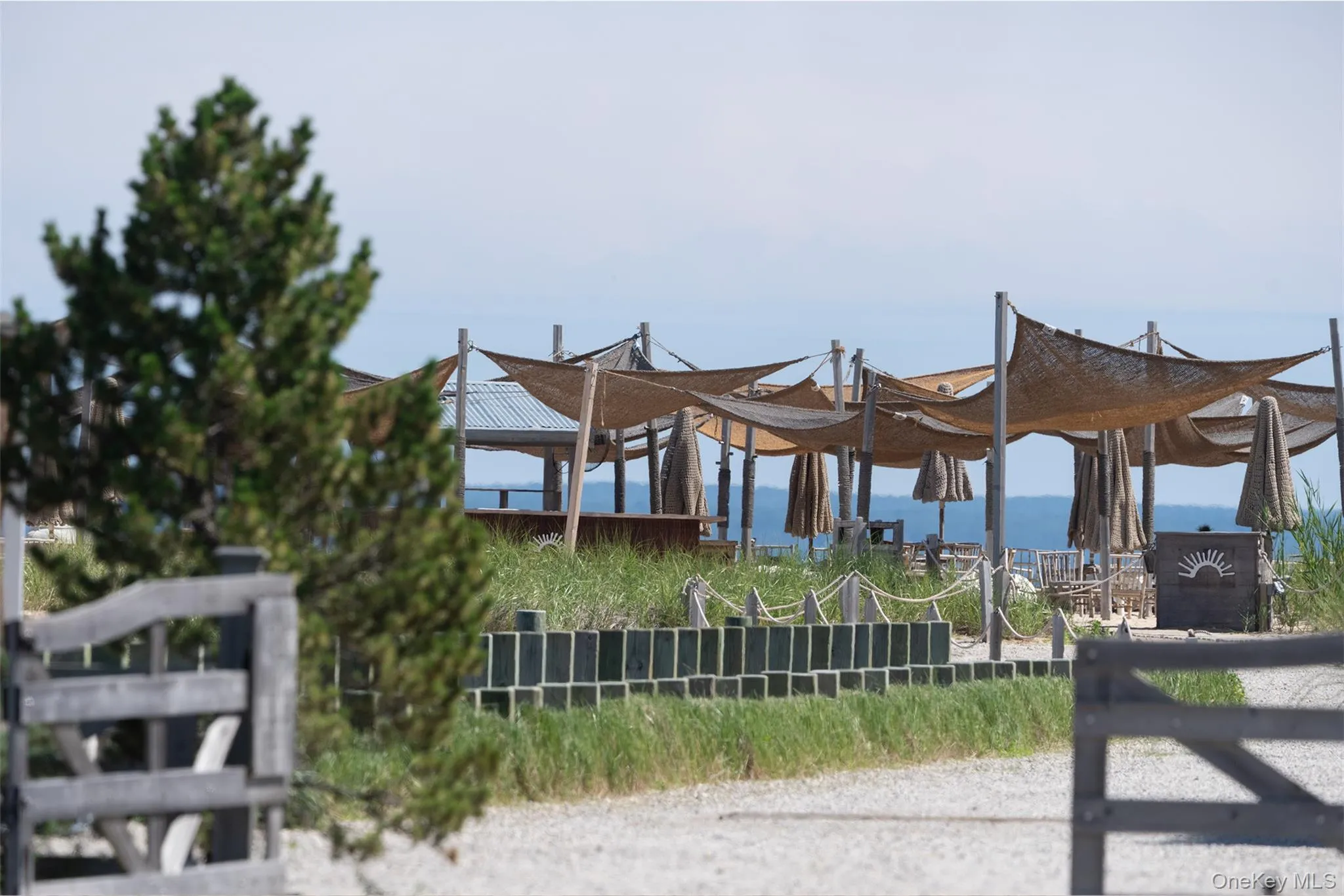 Duryea's outdoor dining with stunning views of the boats and beach lined shores across the street. Duryea's outdoor dining with stunning views of the boats and beach lined shores across the street.