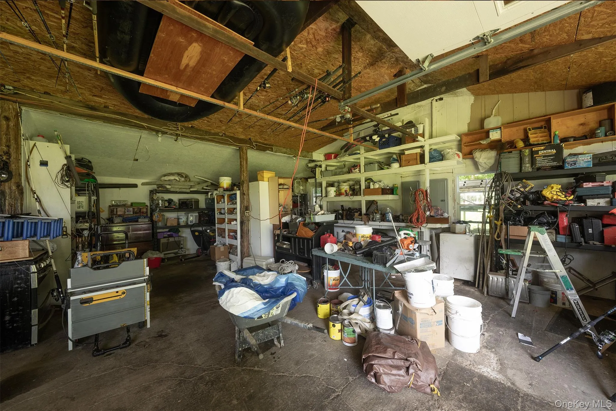 Inside view of the garage and workshop on the historic barn that came from the Orient Point Inn property decades ago. Inside view of the garage and workshop on the historic barn that came from the Orient Point Inn property decades ago.
