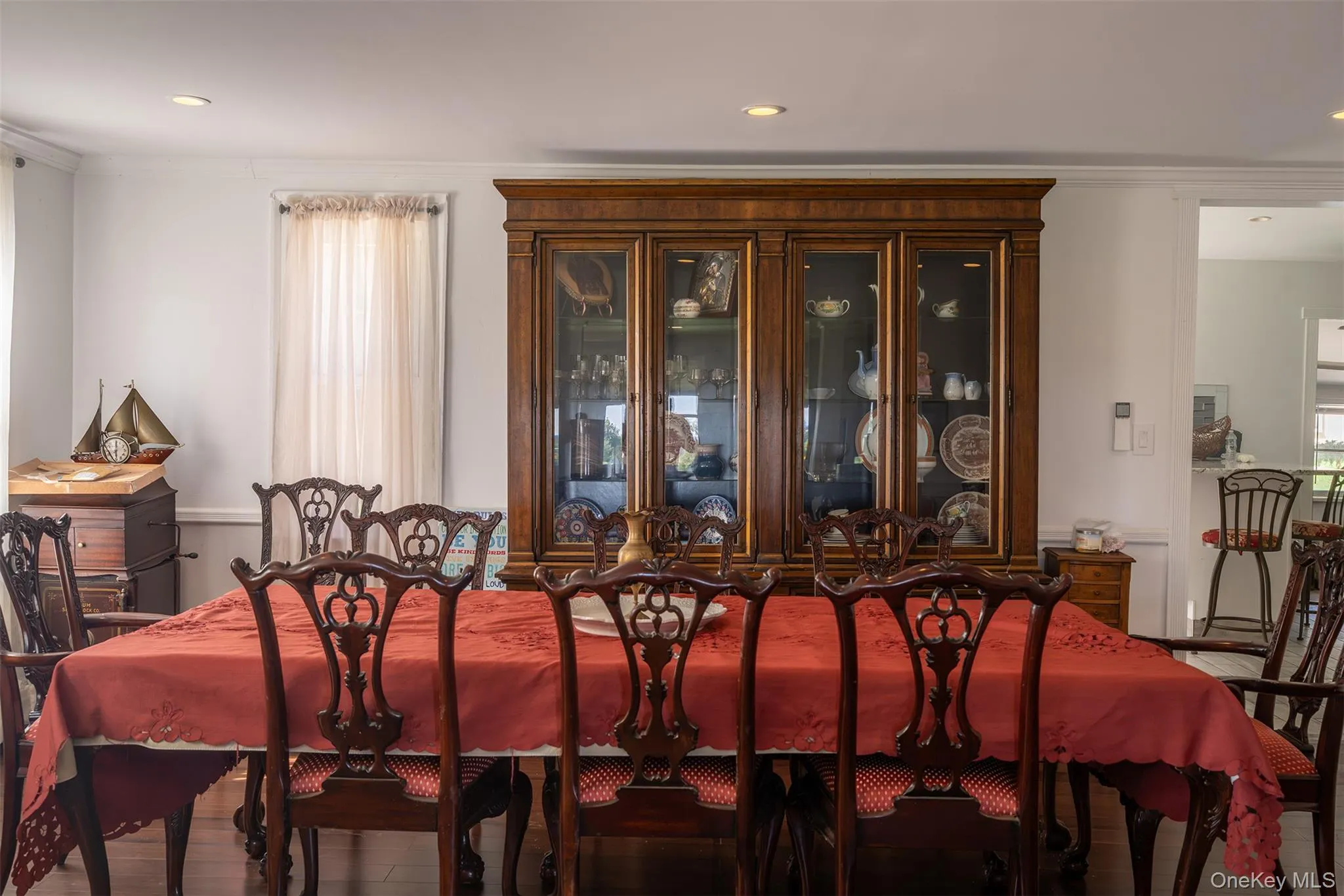 Expansive dining room between the front living room and large farmhouse kitchen behind. Floors are amazing and the updates keep the original wood details showing the charm and character of this classic architecture. Expansive dining room between the front living room and large farmhouse kitchen behind. Floors are amazing and the updates keep the original wood details showing the charm and character of this classic architecture.