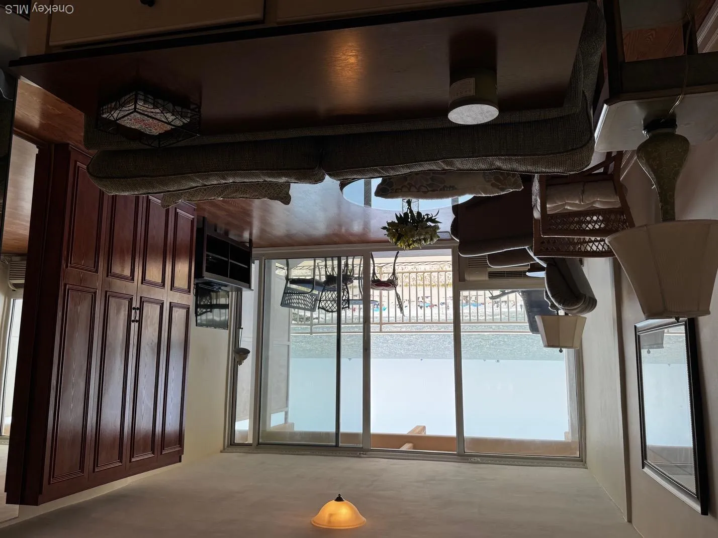 Living room featuring wood finished floors and floor to ceiling windows Living room featuring wood finished floors and floor to ceiling windows