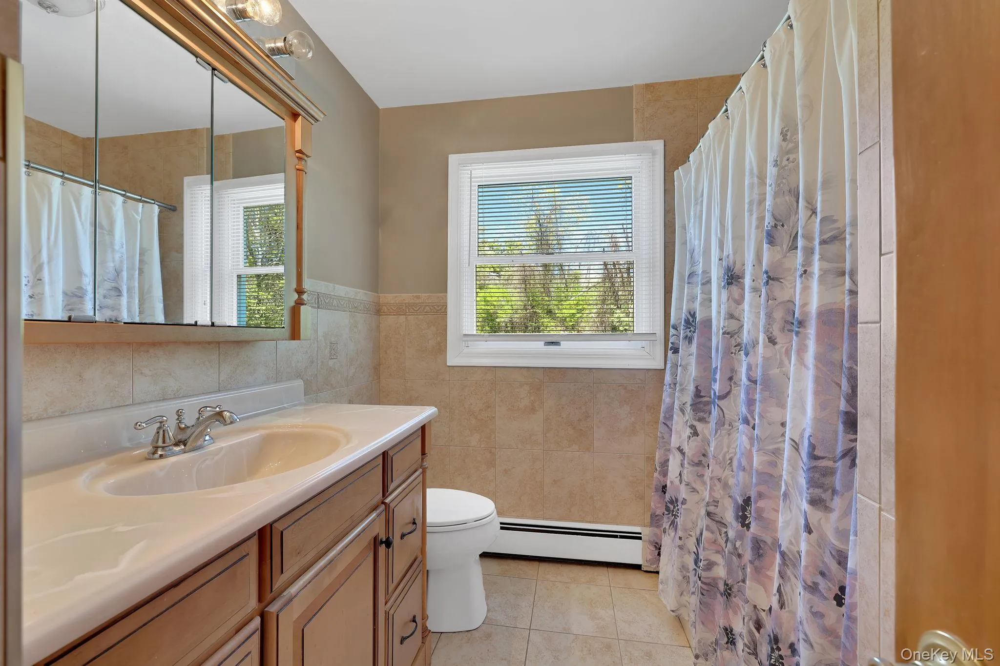 This full bath is located on the same level as the three bedrooms. This full bath is located on the same level as the three bedrooms.