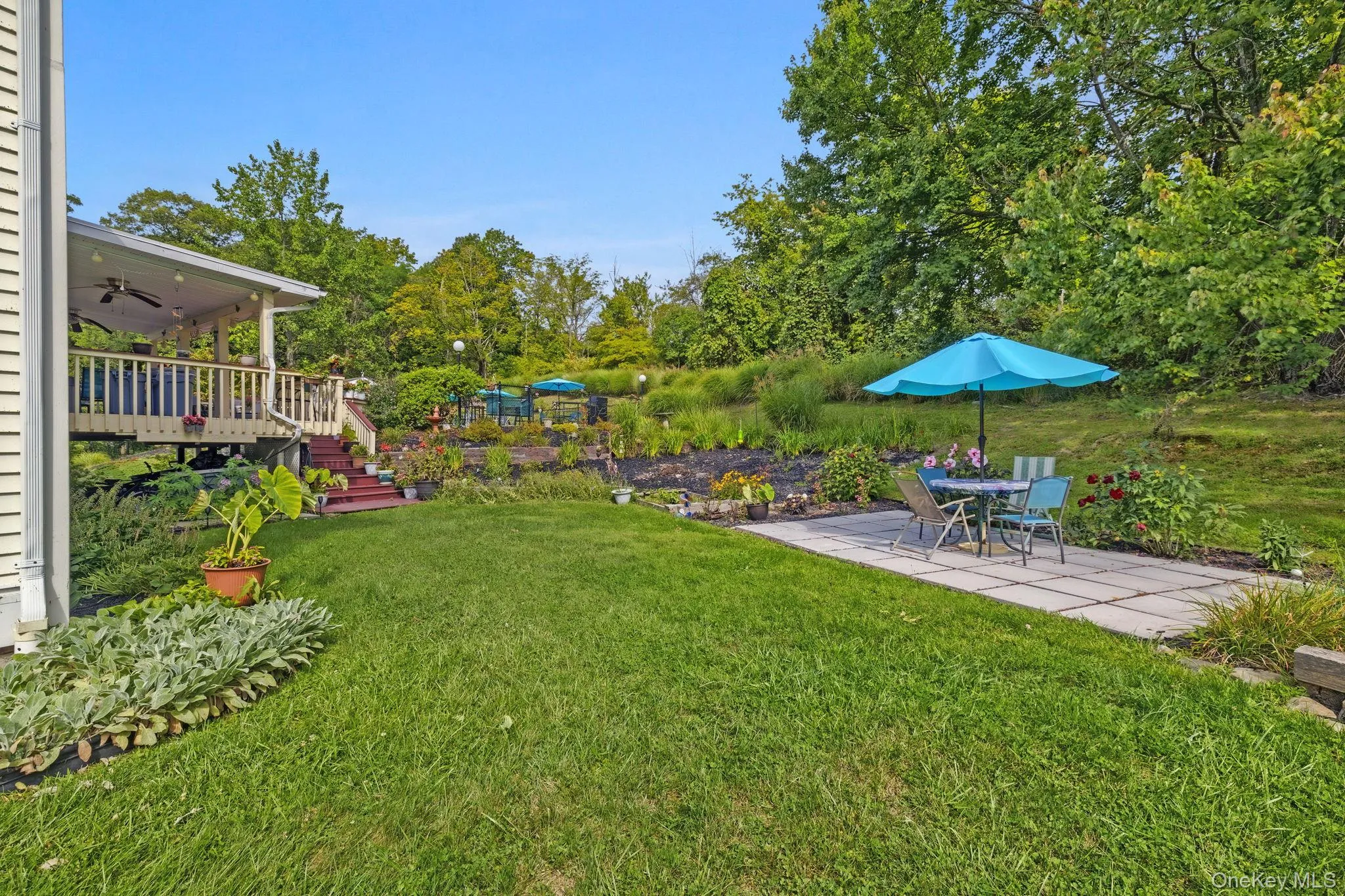 The area beside the vegetable/fruit garden is a perfect place to pause with your freshly picked harvest or simply sit back and enjoy the ever-changing display of flowers blooming from spring through fall. The area beside the vegetable/fruit garden is a perfect place to pause with your freshly picked harvest or simply sit back and enjoy the ever-changing display of flowers blooming from spring through fall.