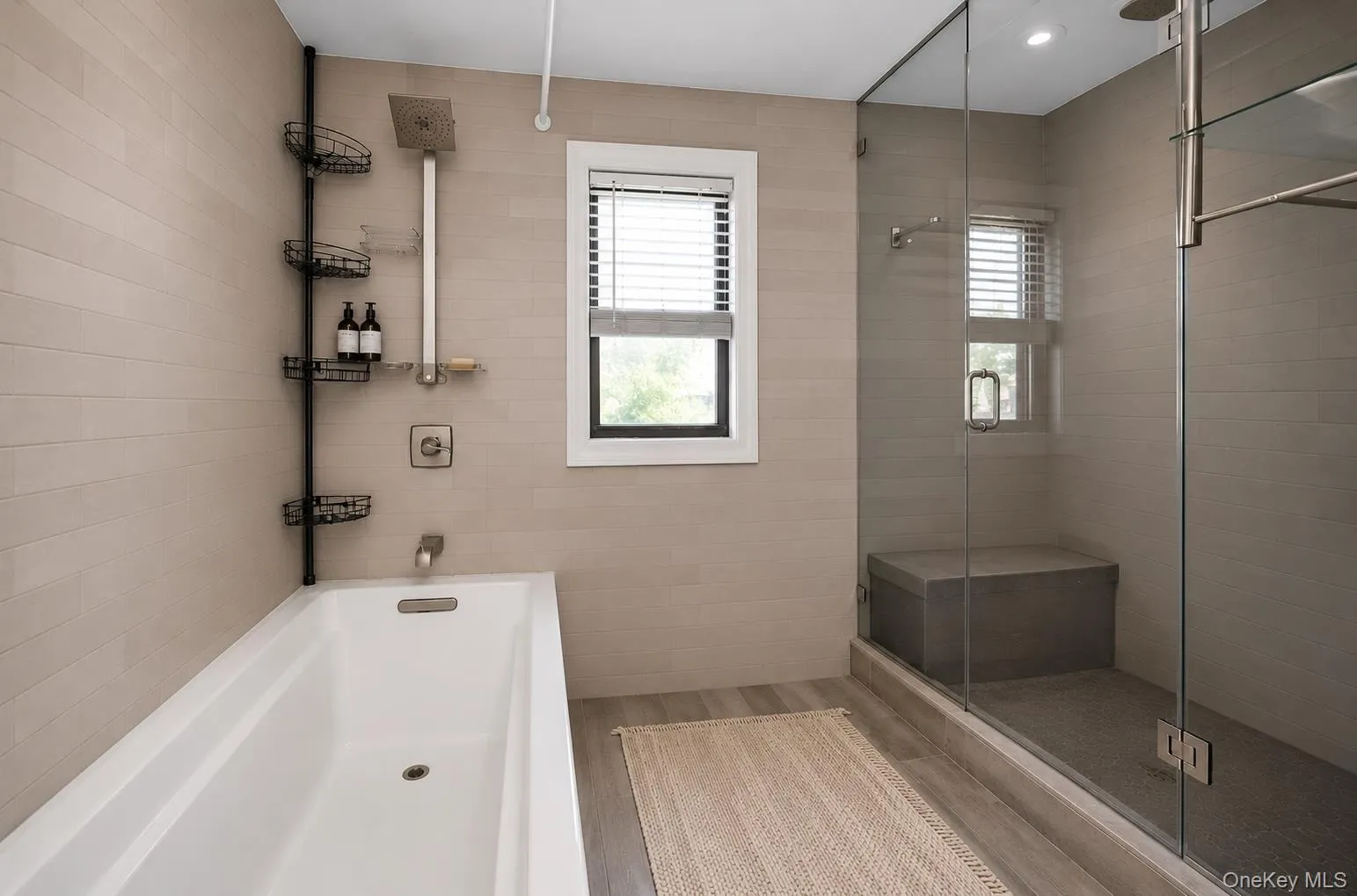 The second floor bathroom has both a tub and a shower. The second floor bathroom has both a tub and a shower.