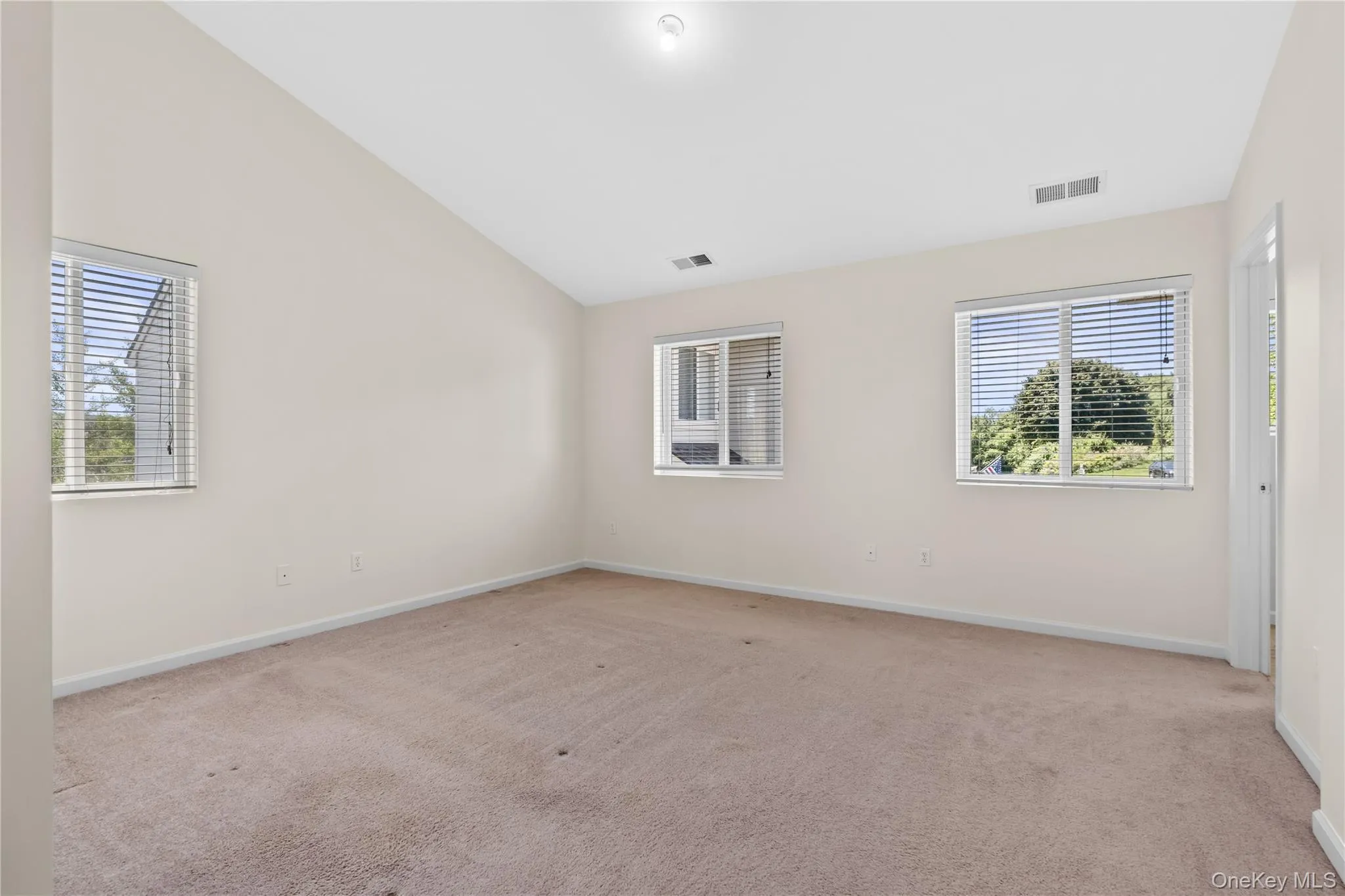 Primary bedroom is huge with double exposures and vaulted ceiling. Primary bedroom is huge with double exposures and vaulted ceiling.