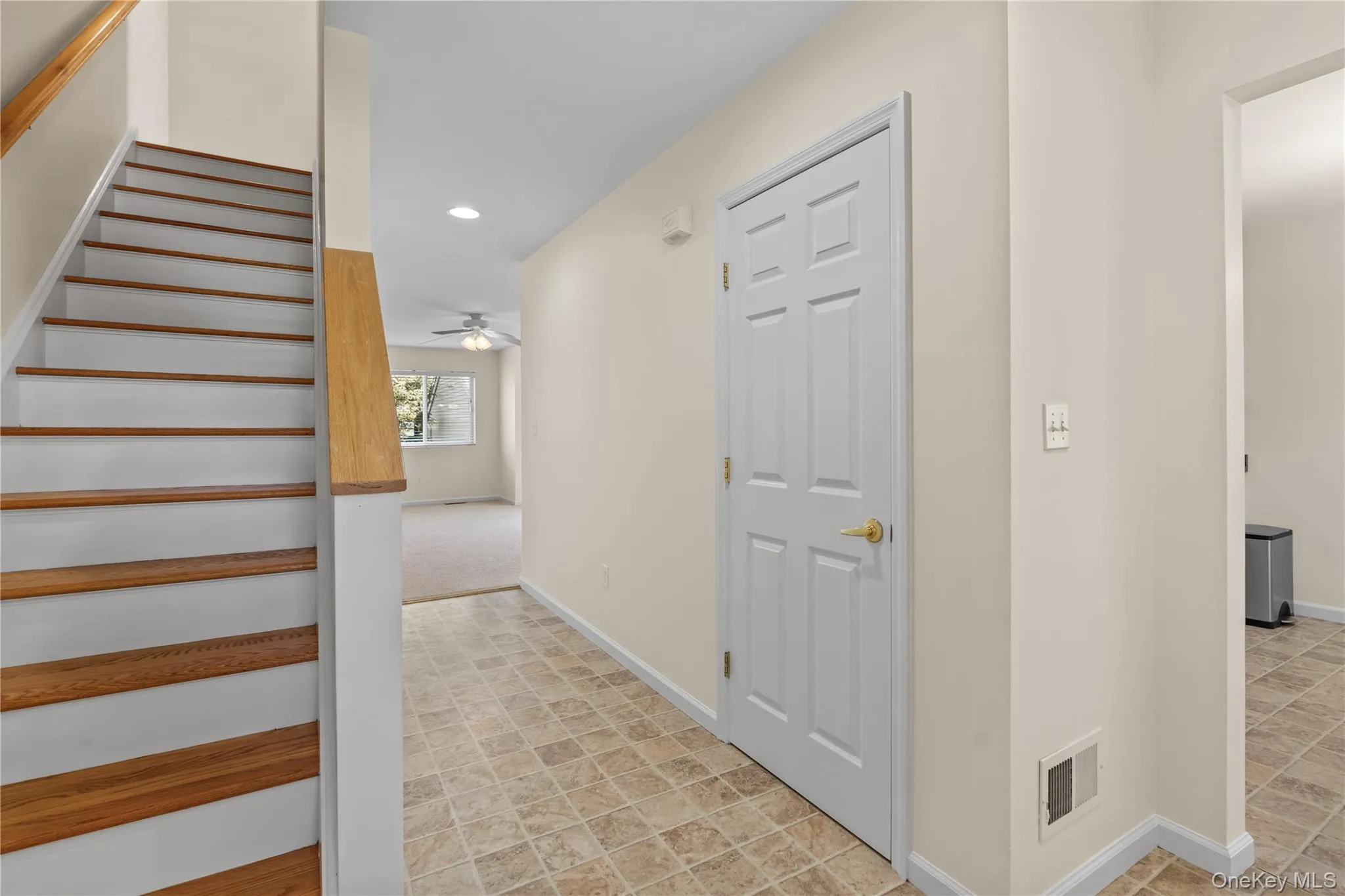 Entry and stairs to second level. Entry and stairs to second level.